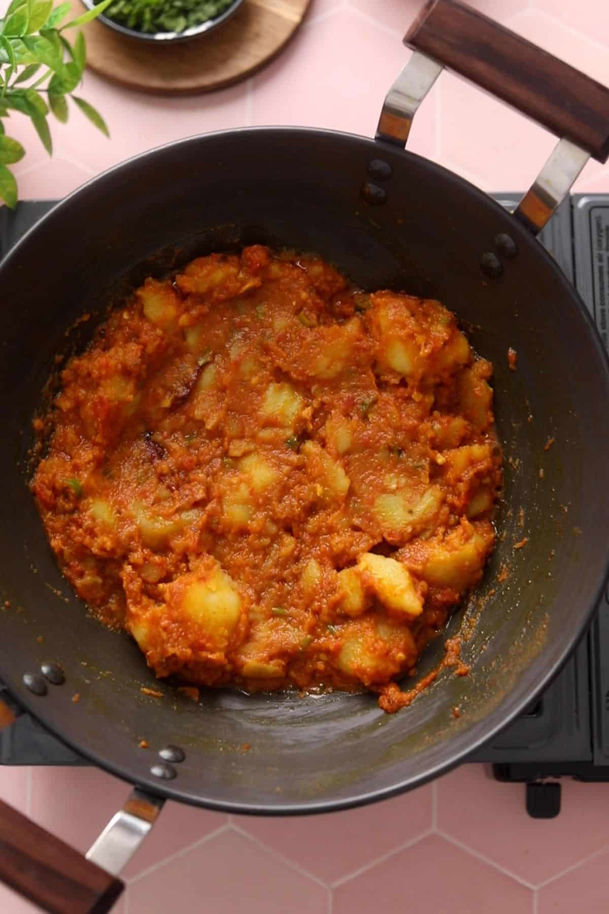 Boiled Potatoes are added to the tomato masala.