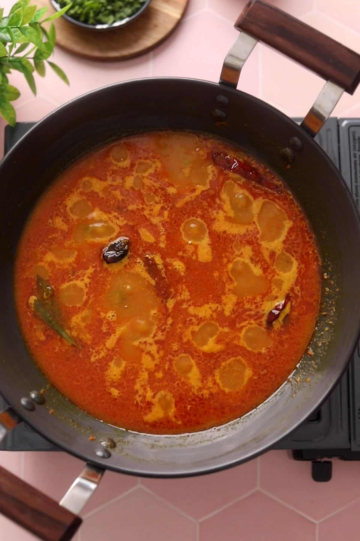 Water is added and the aloo curry is left to slow simmer. 