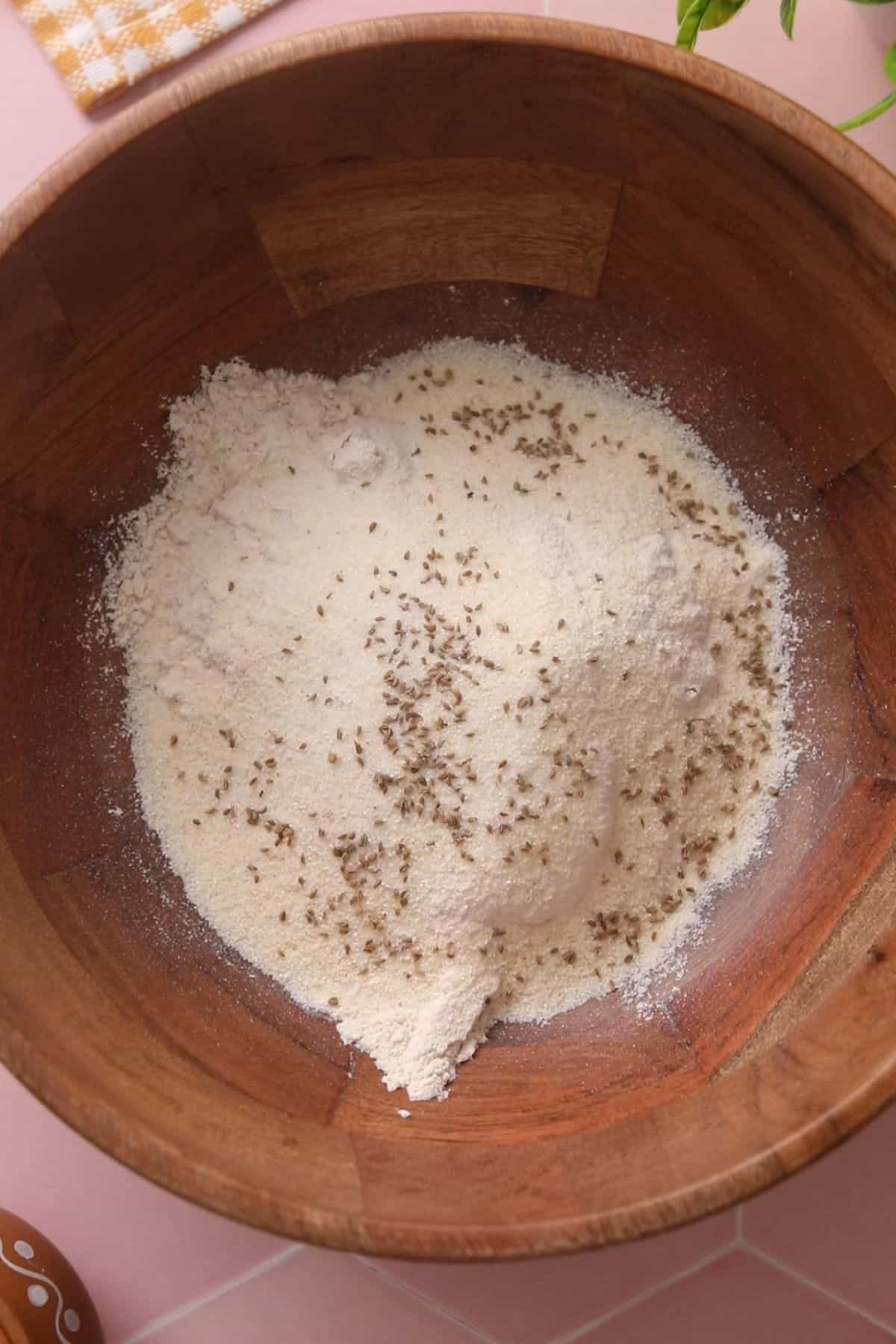 Poori ingredients in a brown wooden bowl. 