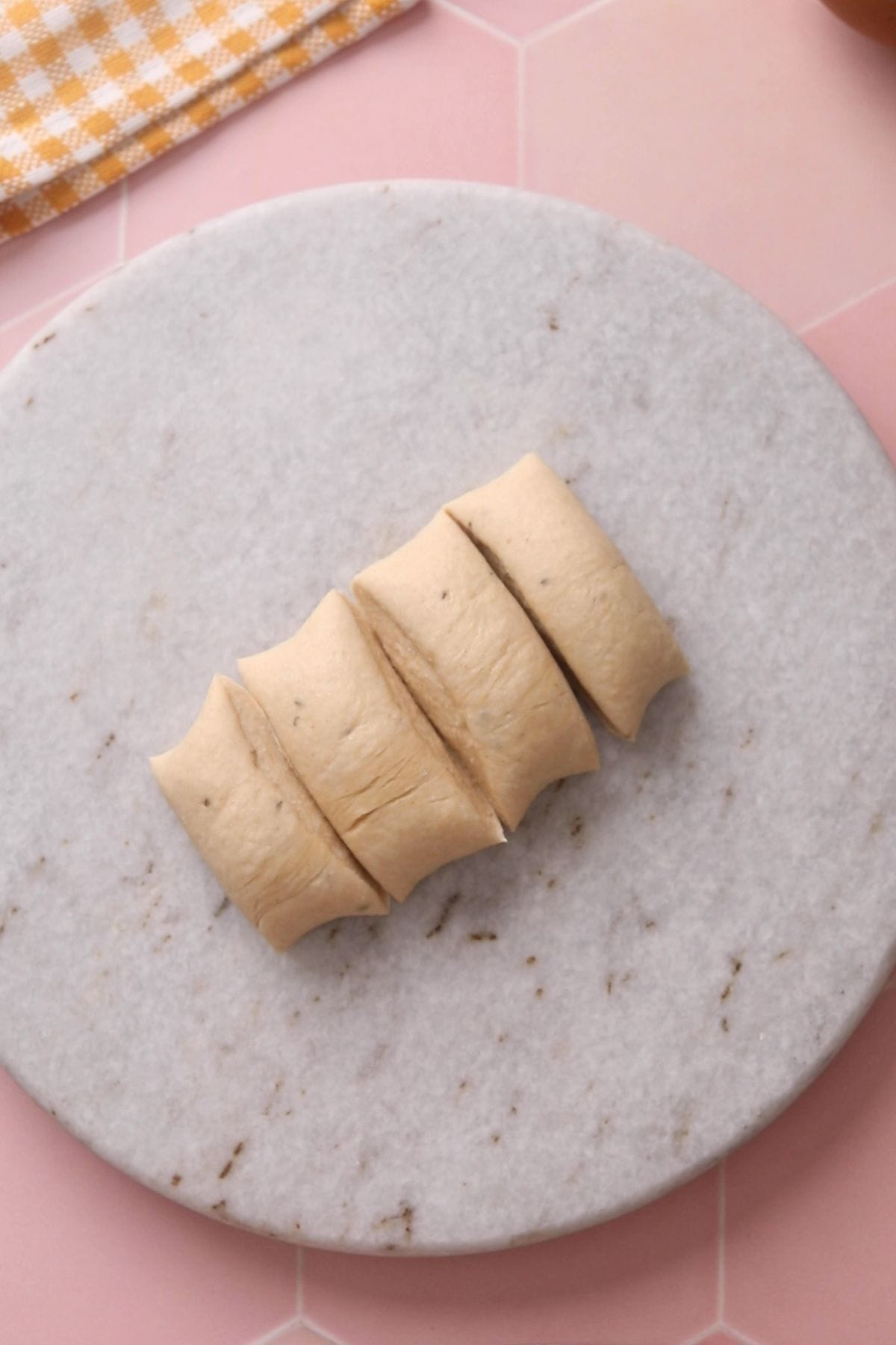 Dividing poori dough into portions.