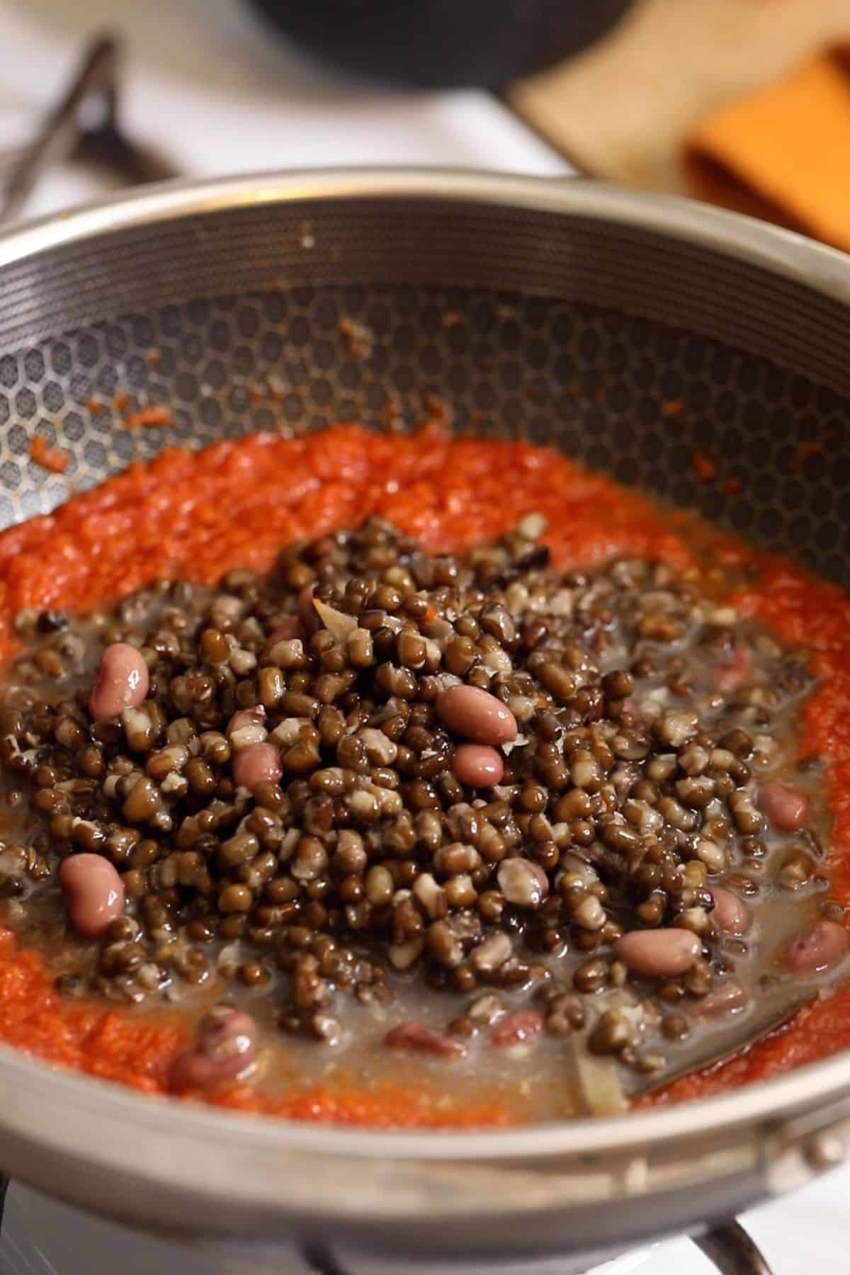 Boiled lentils are added to the tomato onion base.