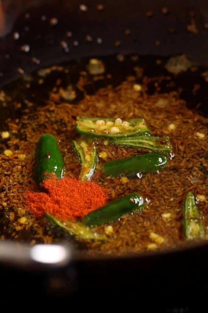 Temper oil with spices and chili.