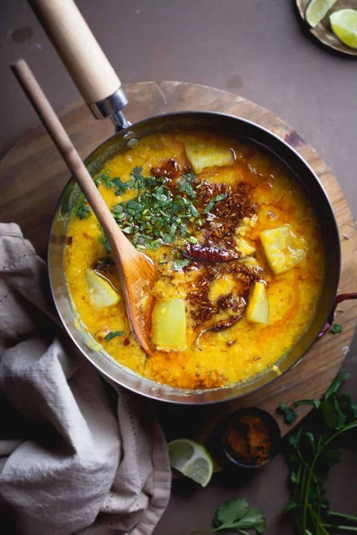 Chana Dal With Lauki Served in a steel pot. 