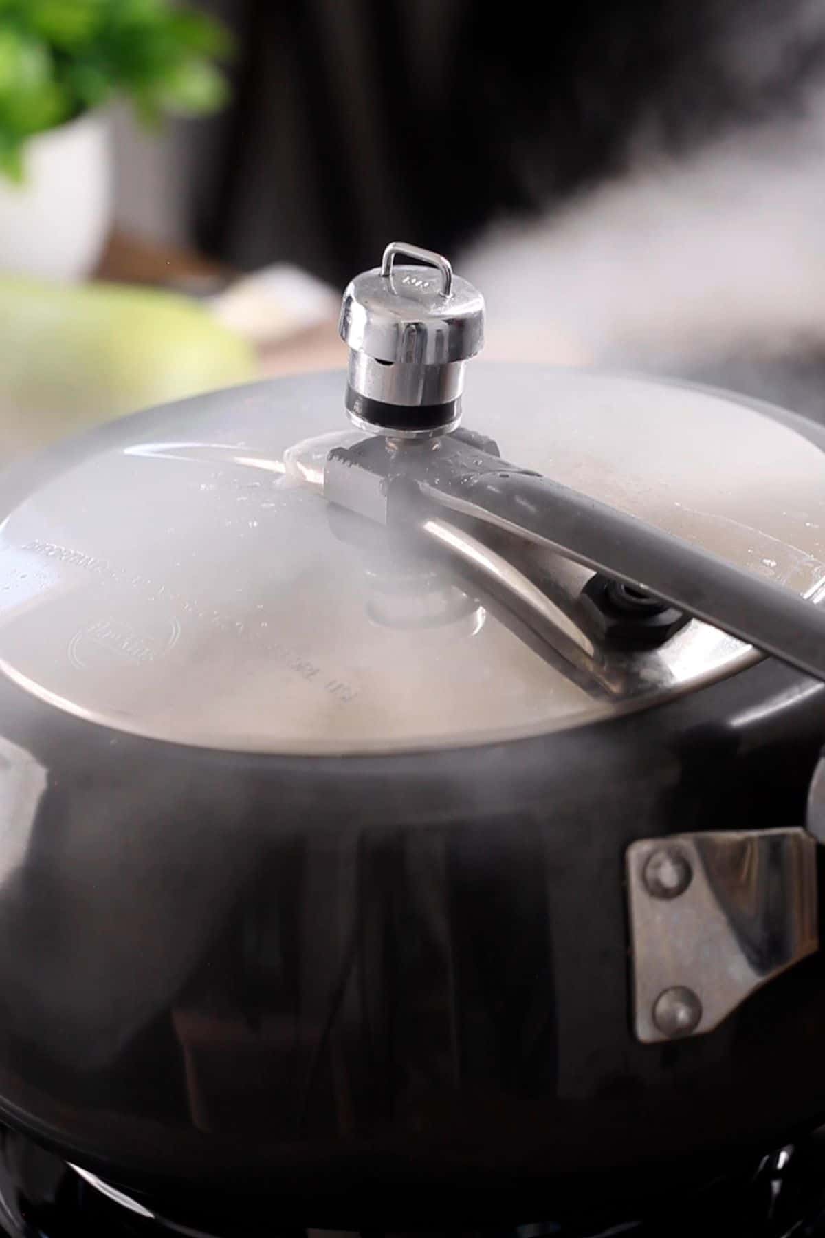 Pressure cooker whistling.