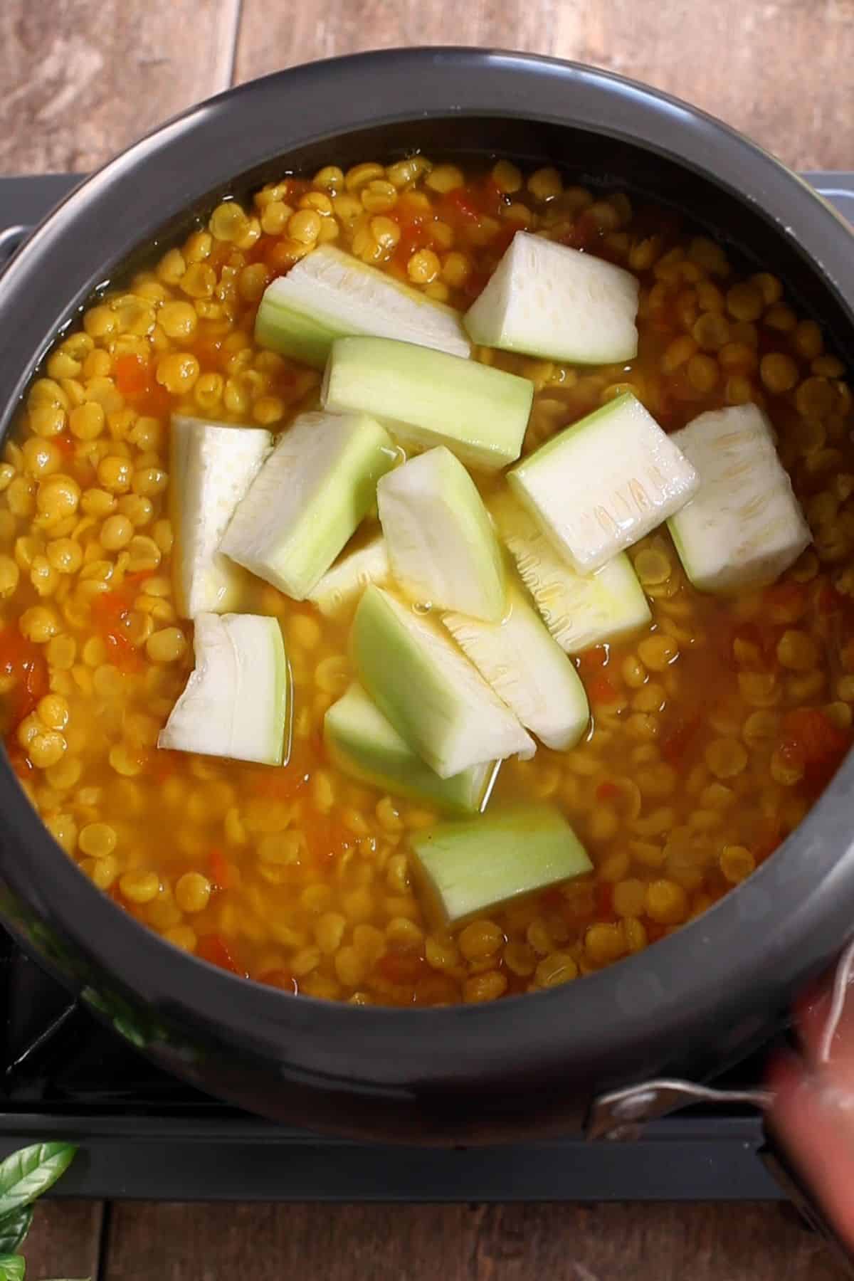 Lauki added to par cooked chana dal.