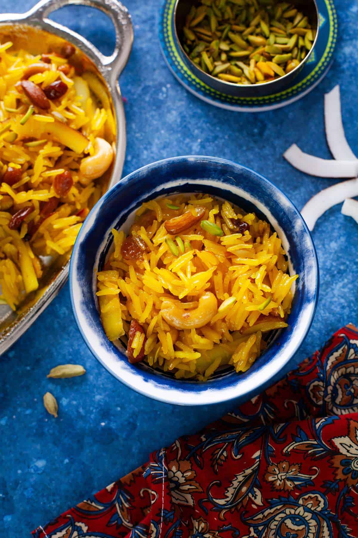 Meethe chawal served in a blue bowl. 