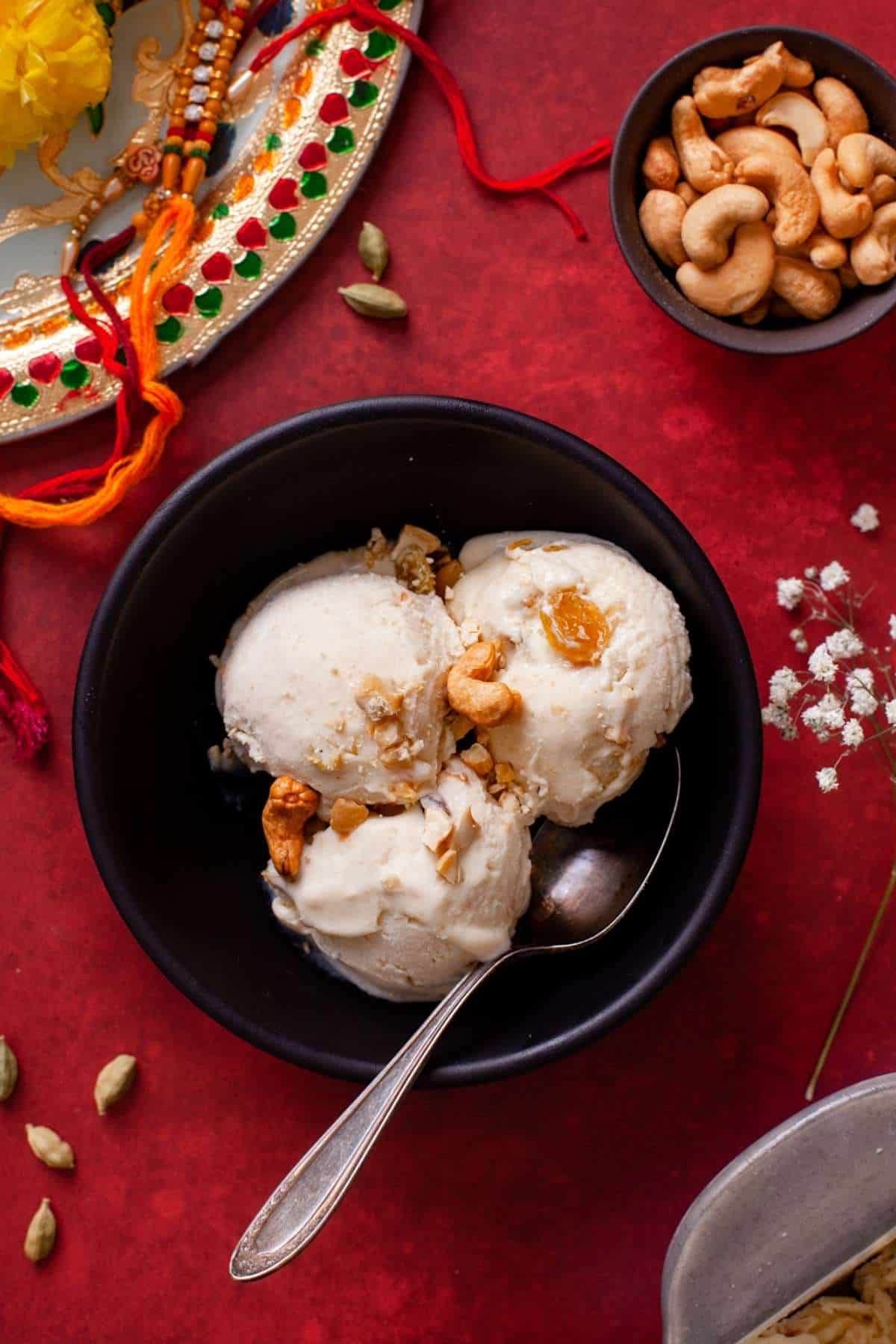 eggless homemade cashew ice cream on a red background.
