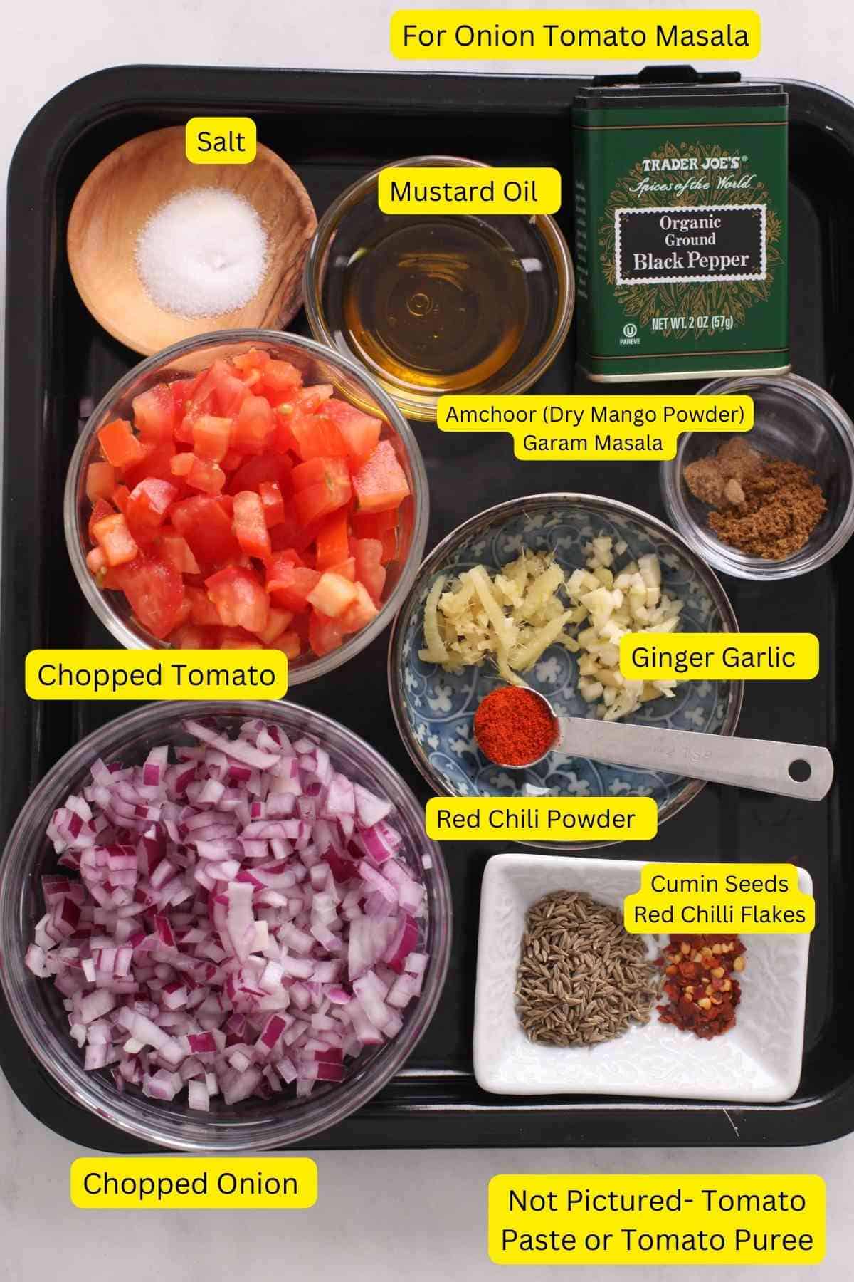 Ingredients needed to make the tempering of the sabut masoor dal.
