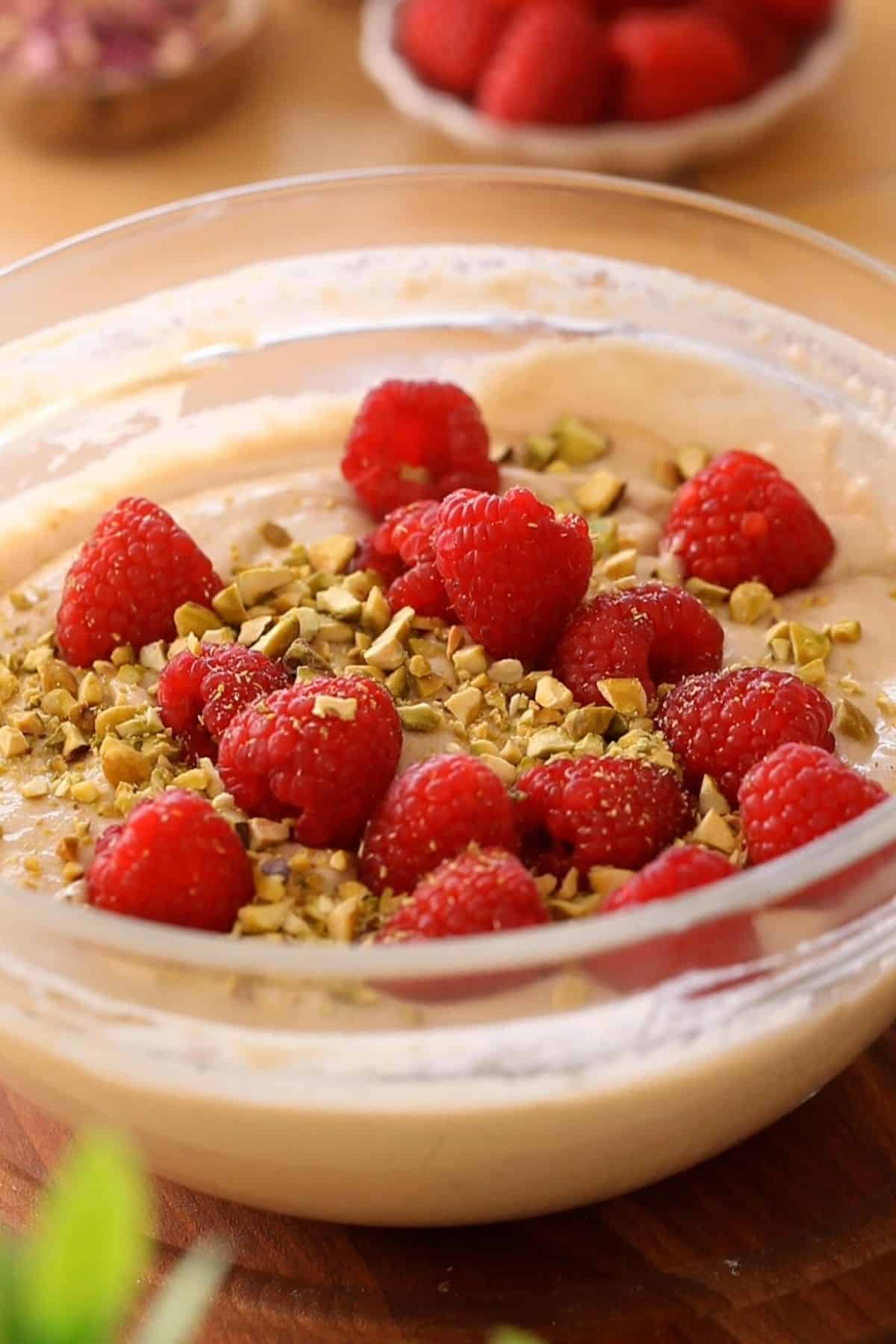 Raspberries and pistachios are added to rosewater cake batter.