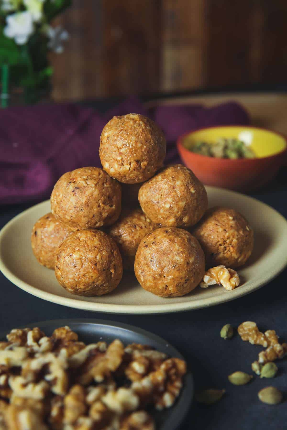 Stack of Walnut Ladoo in a moody image. 