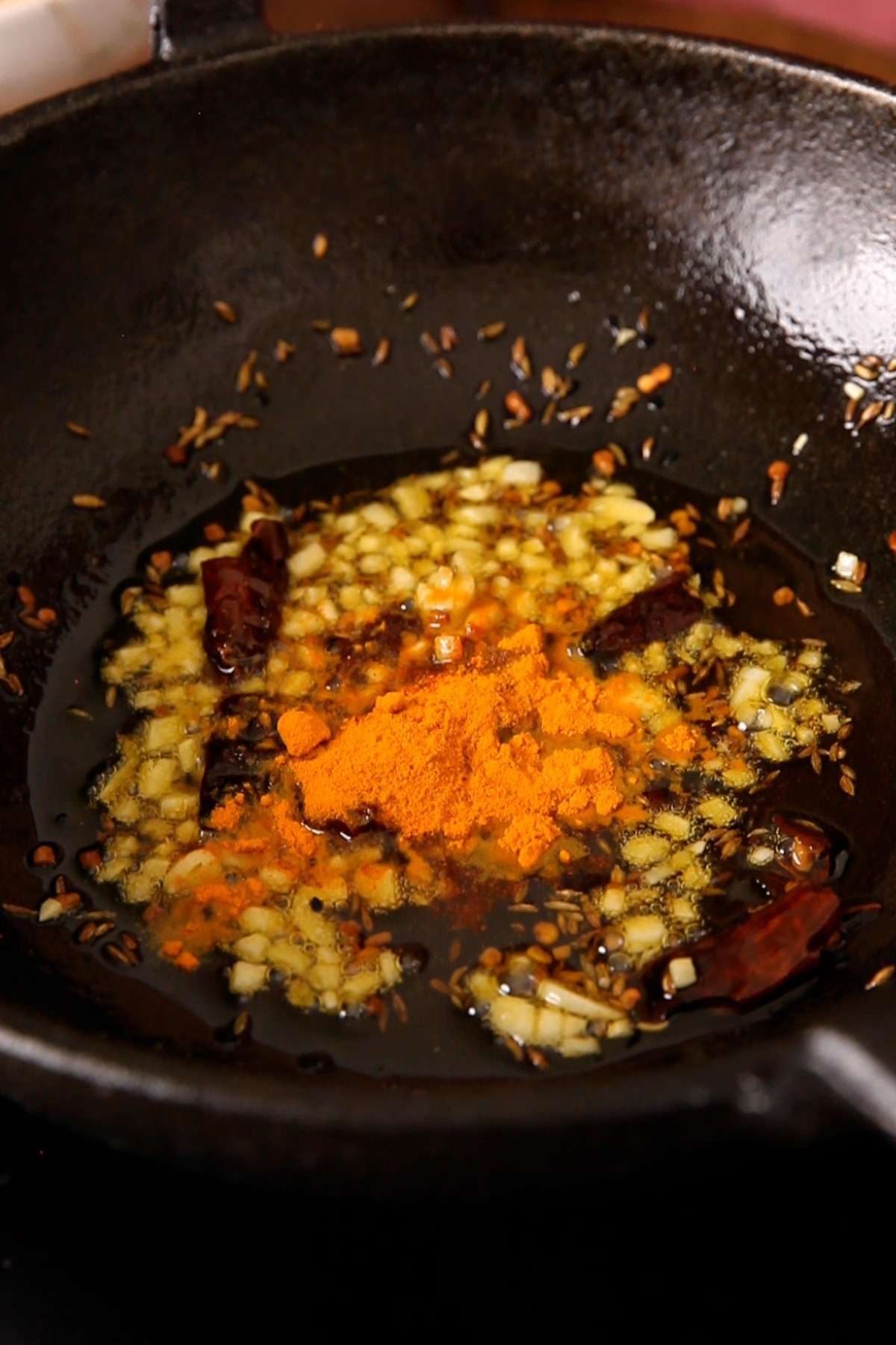 Add powdered spices next.