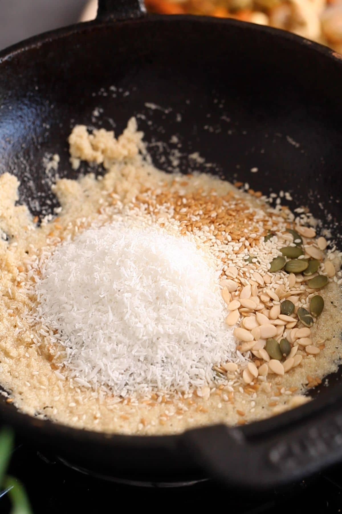 Seeds and coconut are added to semolina.