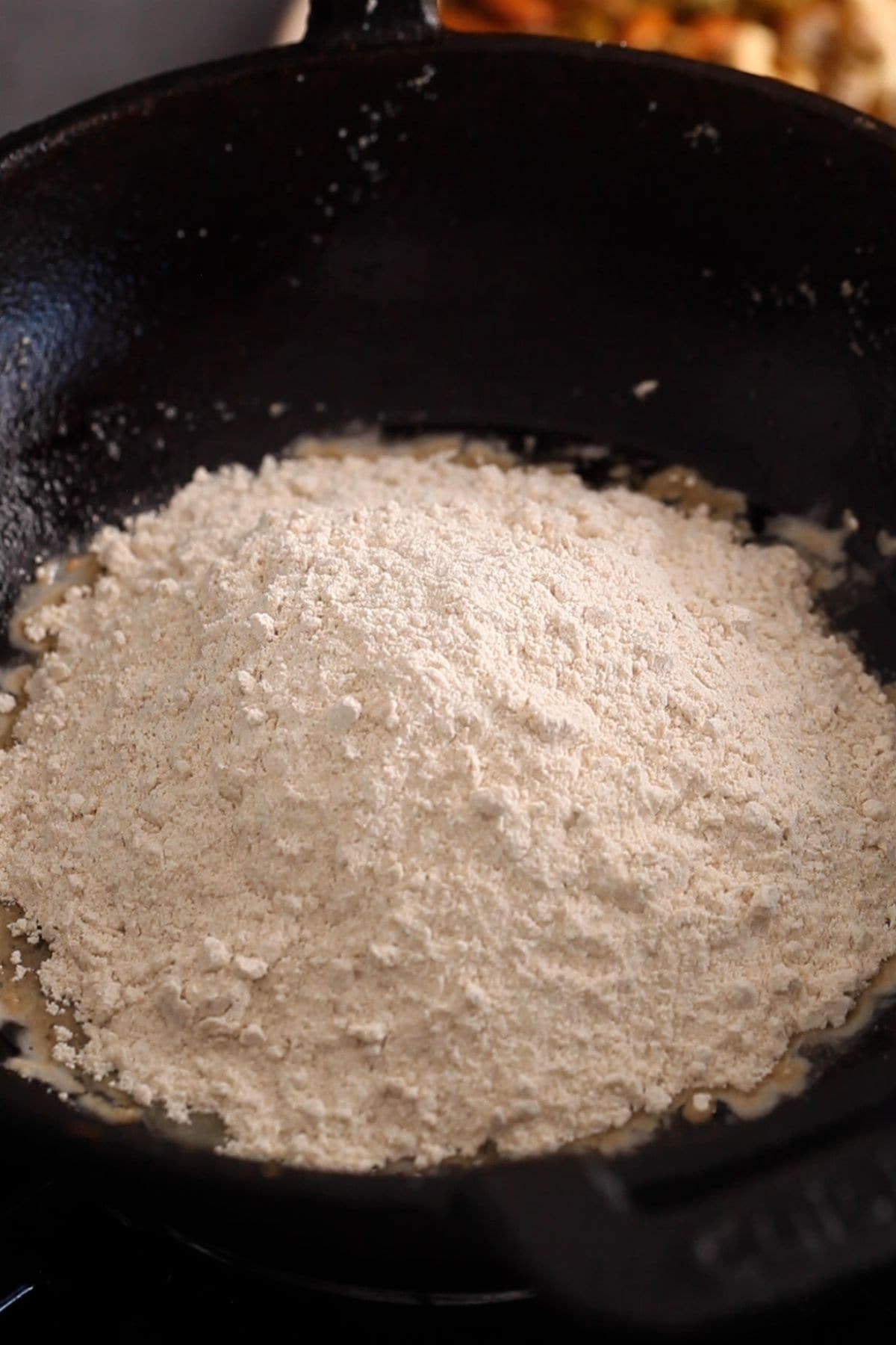 Atta is added to ghee for roating.