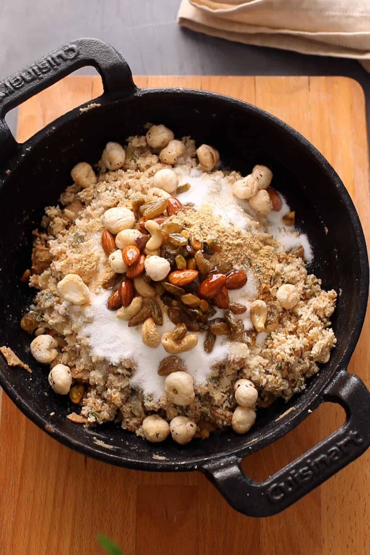 All the panjiri ingredients are combined togther with suagr and spices. 