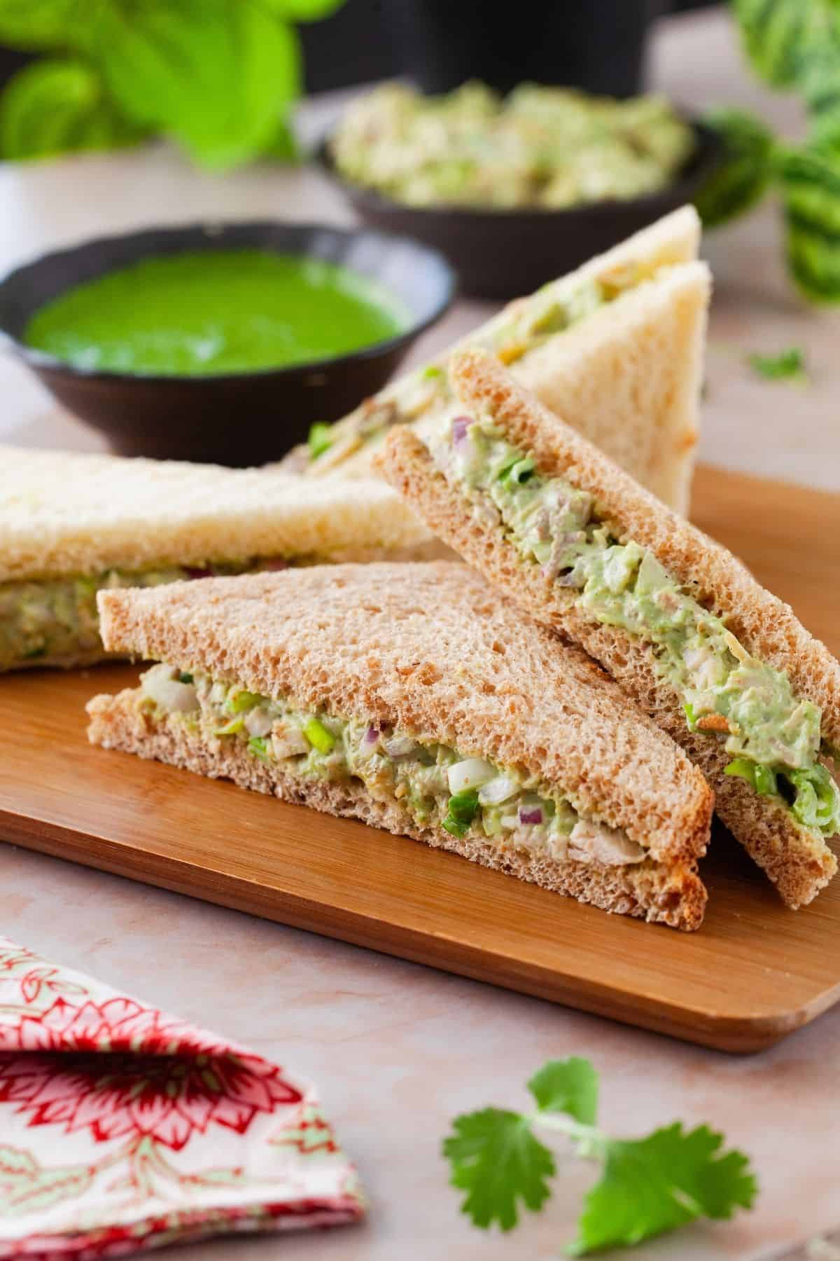 Chicken Chutney Sandwich placed on a brown board.