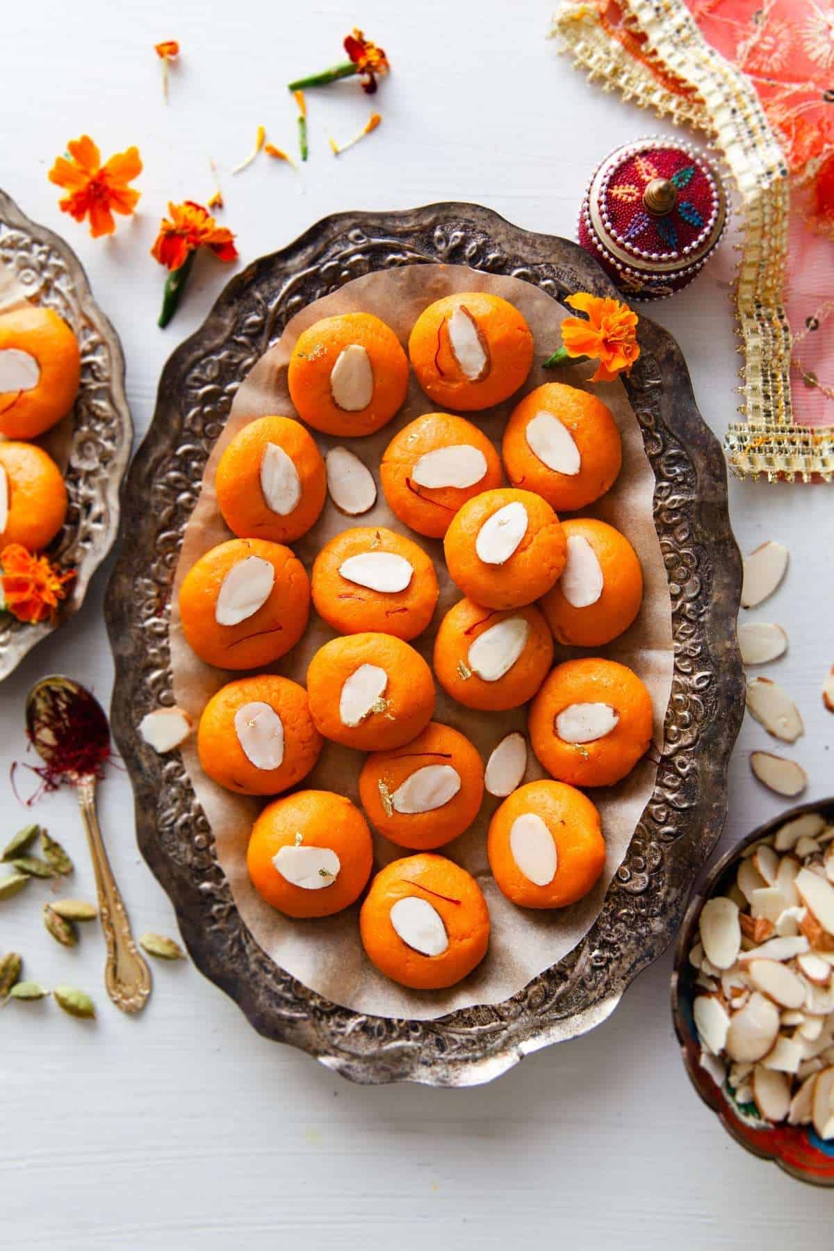 Peda in an Oval Silver Platter decorated with almonds and saffron
