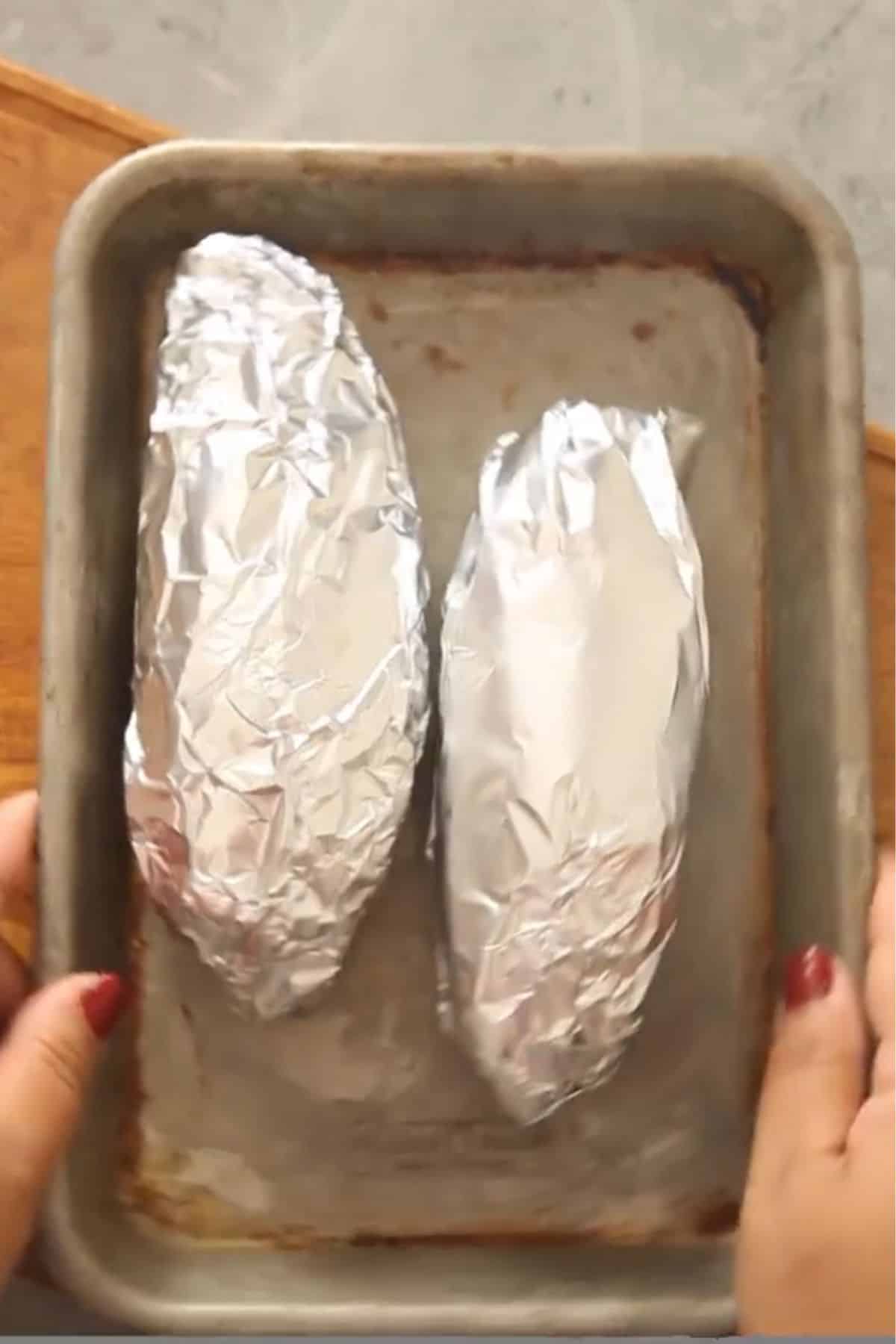 Sweet potatoes wrapped in aluminium foil. 