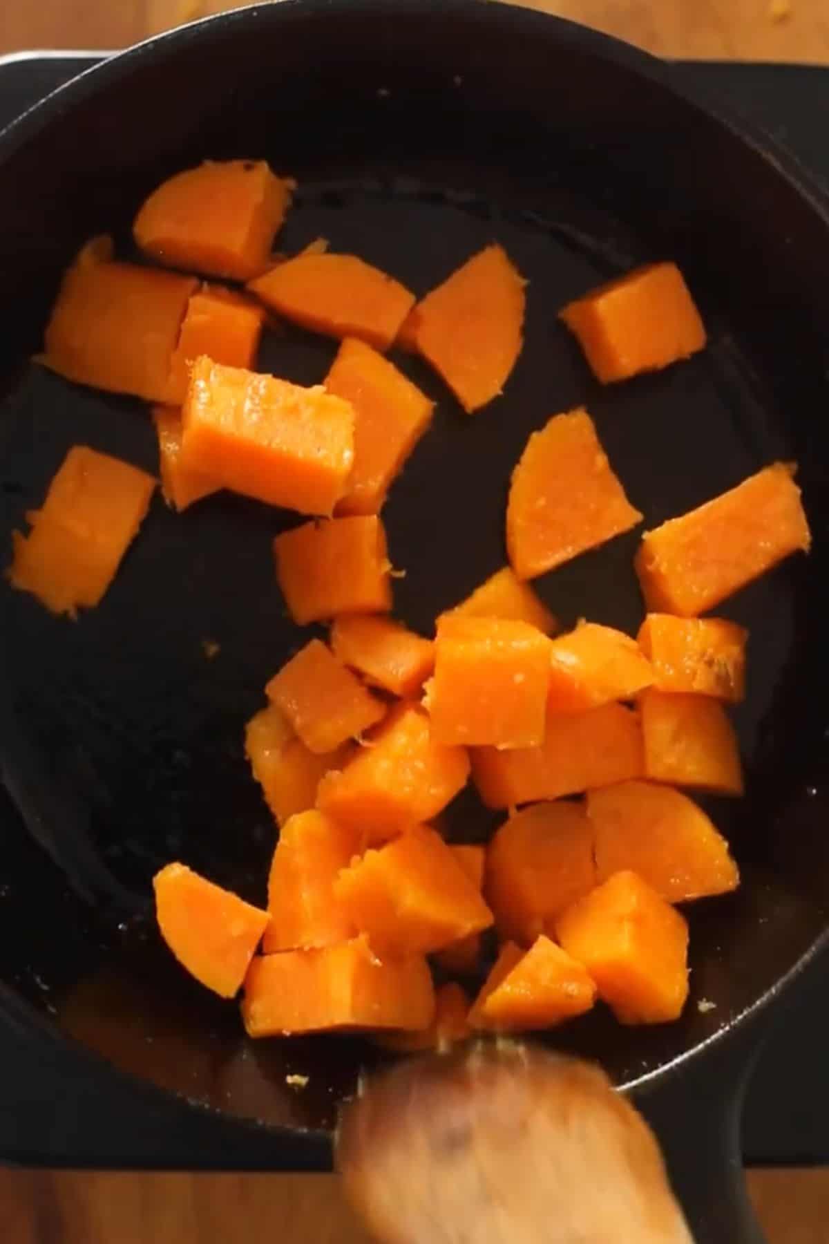 Sweet potato cubes are sauteed in ghee.