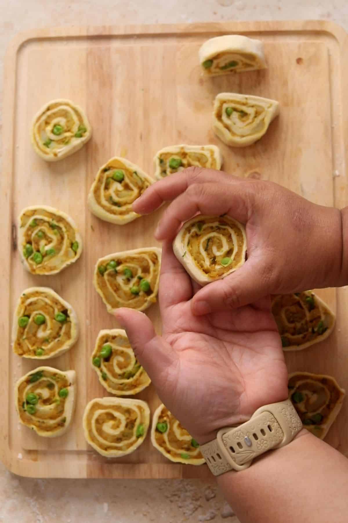Shaping the spiral pinwheels to make them round.