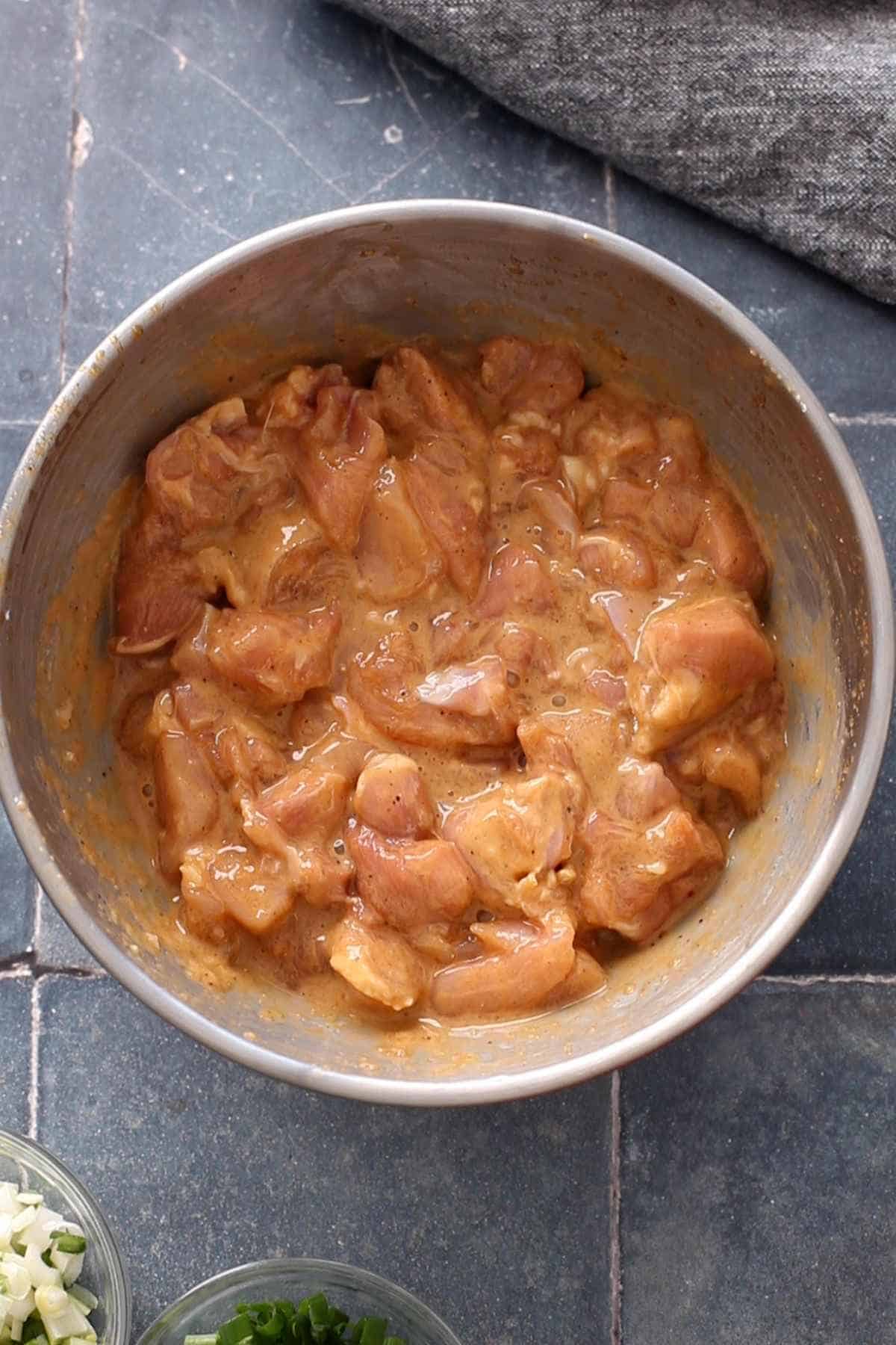 Coated chicken ready for deep frying.