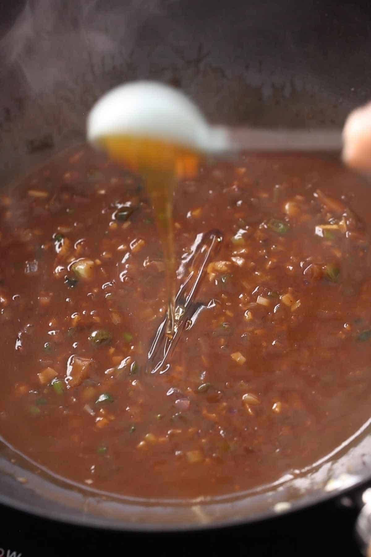 Mix in the honey with the manchurian sauce.