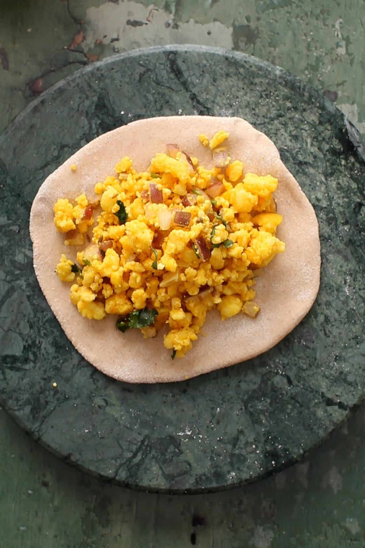 Paneer filling is plaed in the dough.