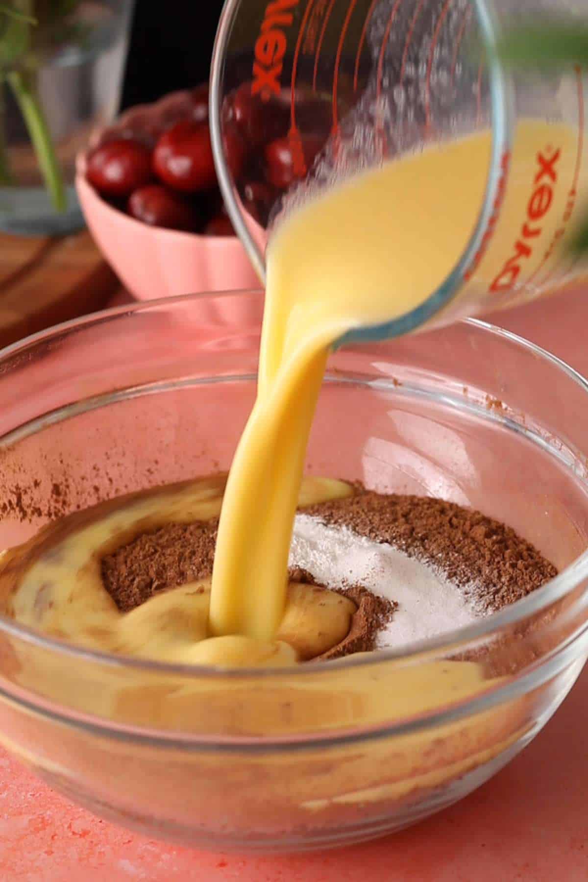 Pouring wet ingredinets to the dry ingredients.