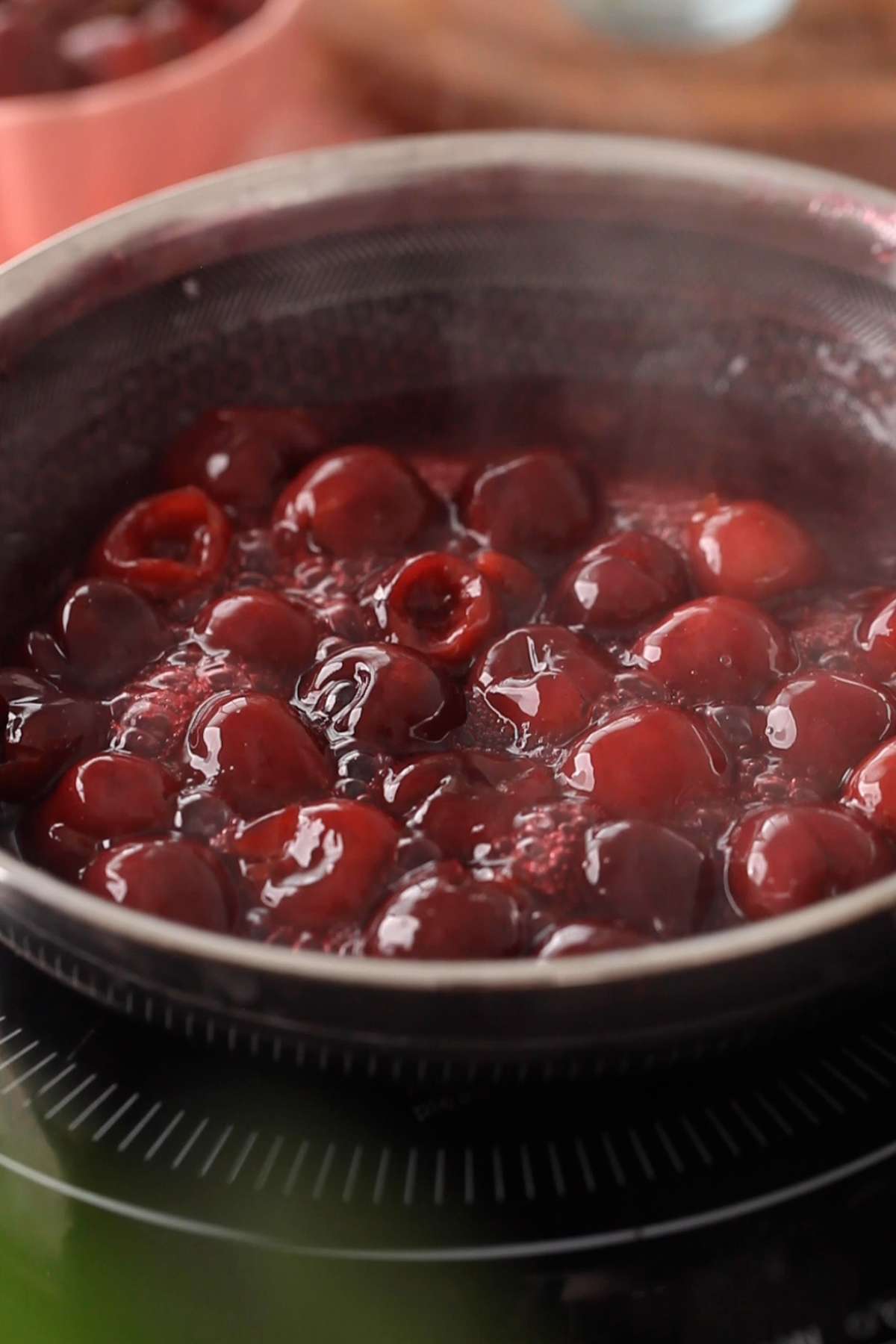 Cherry compote is thick and bubbly after cooking.