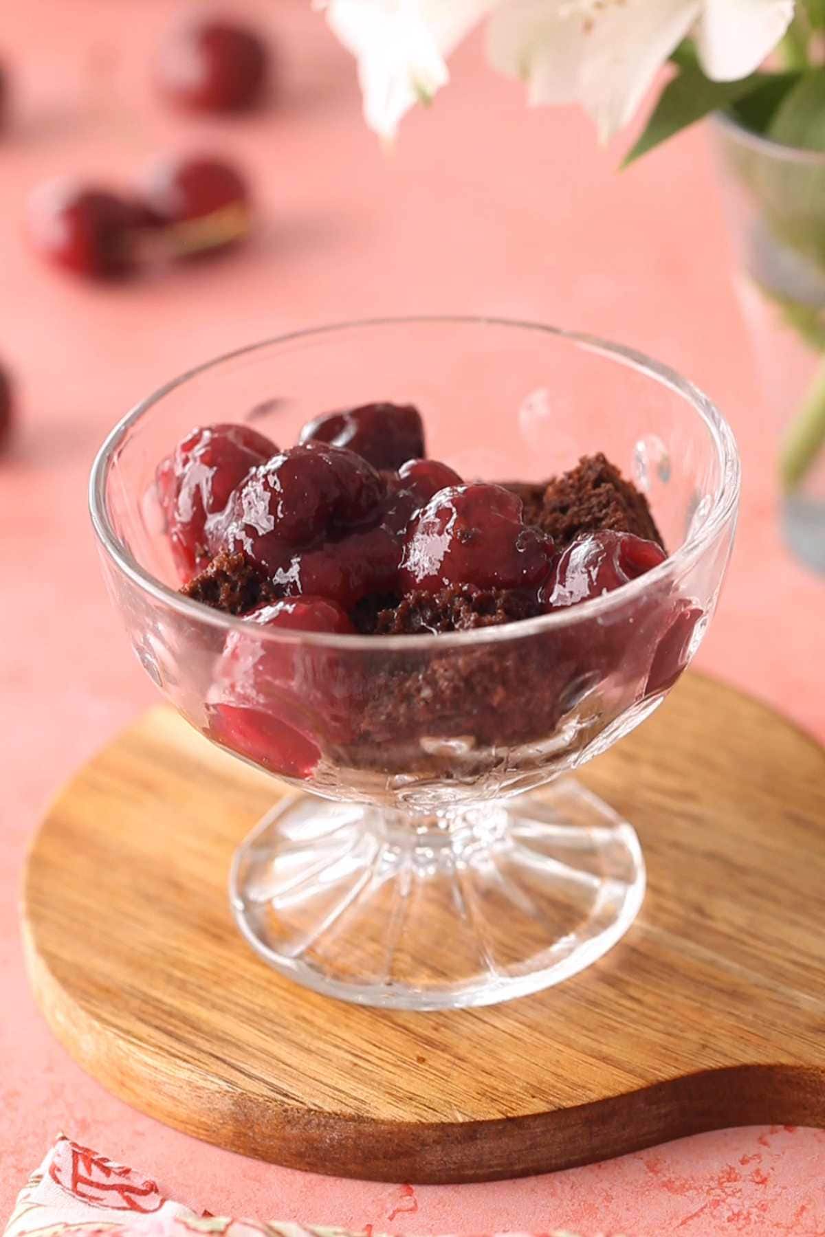 Layer of cherry pie filling on chocolate cake.