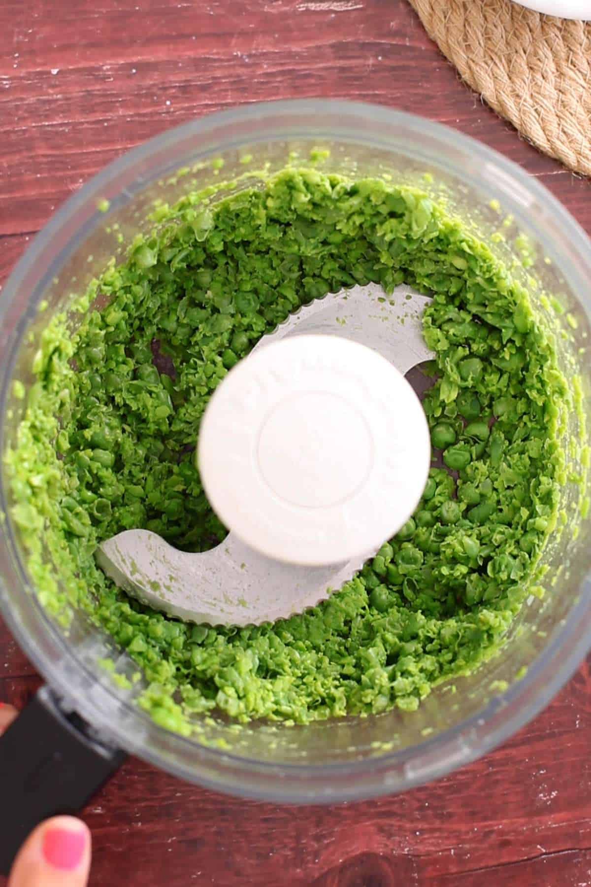 Grinding peas using food processor.