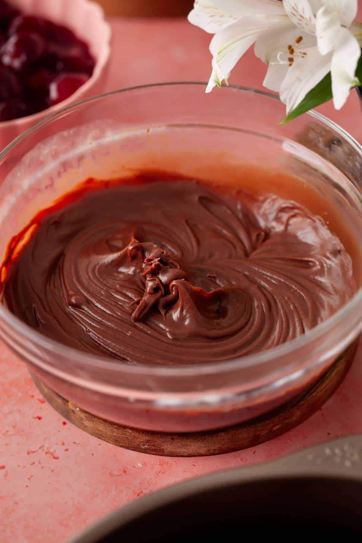 Whipped chocolate pudding in a glass bowl.
