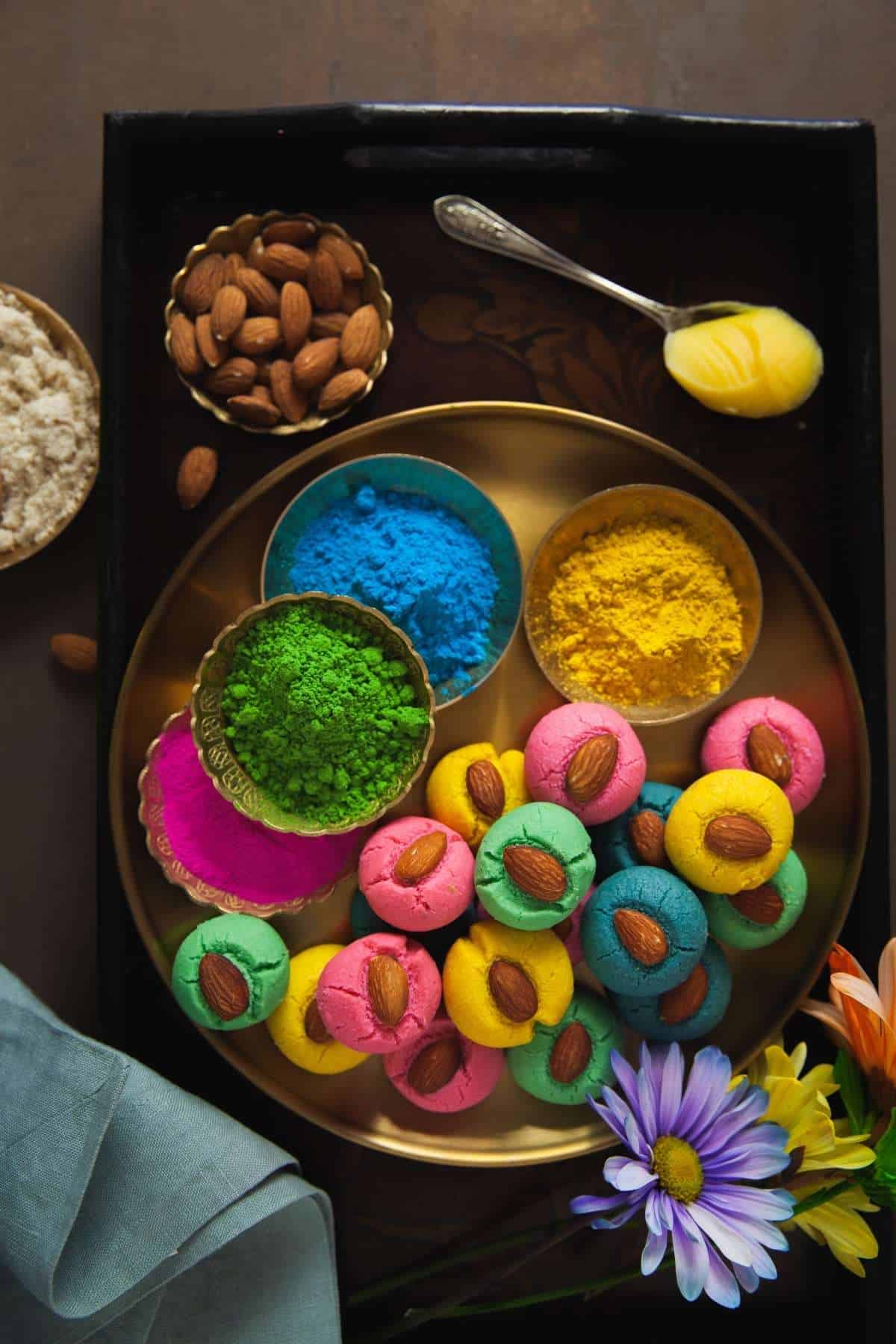 Thandai Spiced Badam Nankhatai With Holi Powder On a Gold Plate