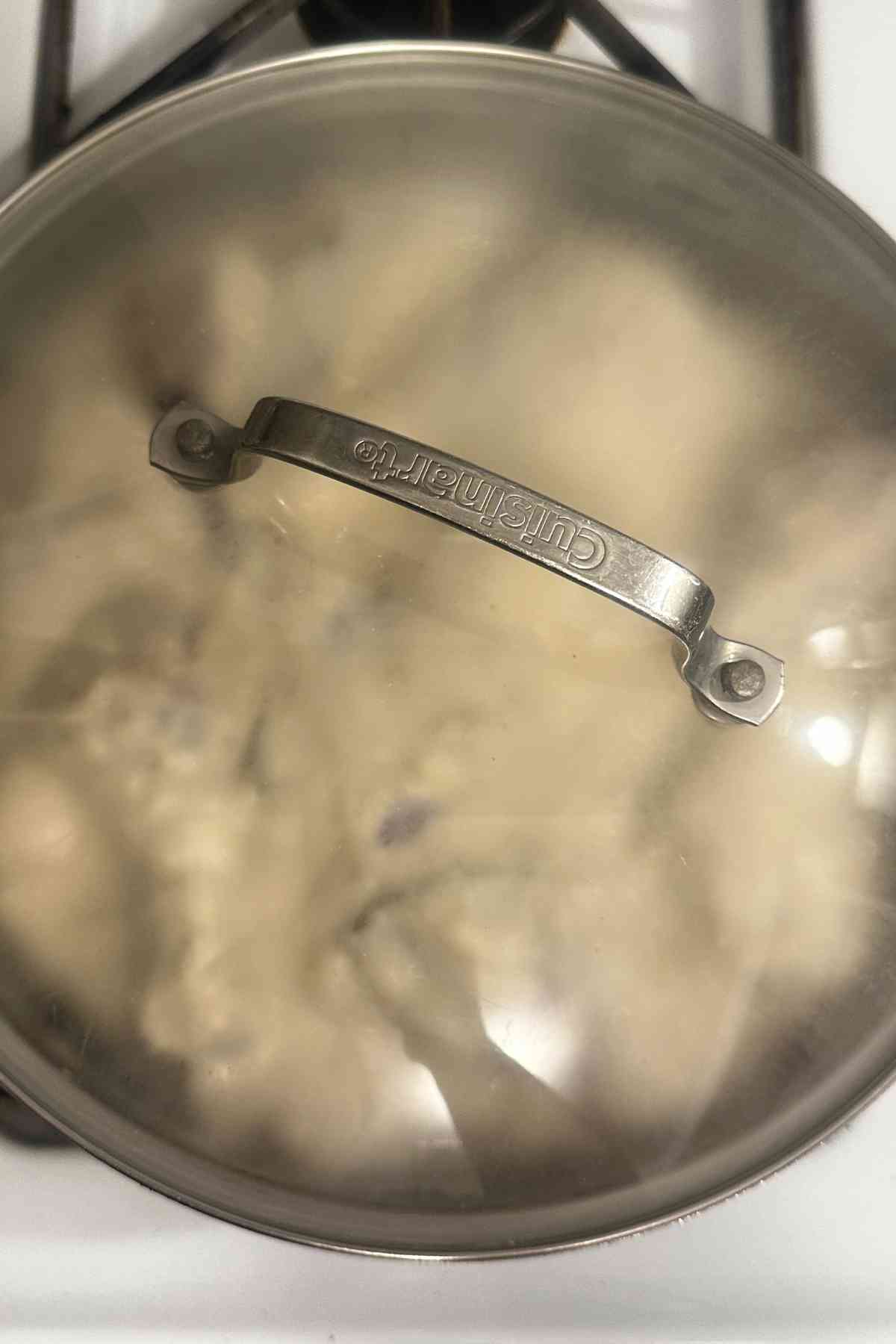 Cover the pot to cook the chicken.