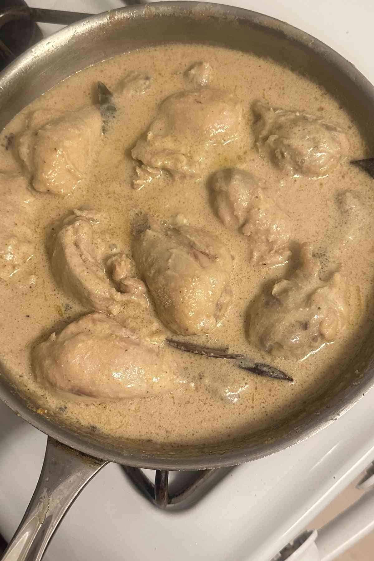 Finish the chicken rezala with kewra water.