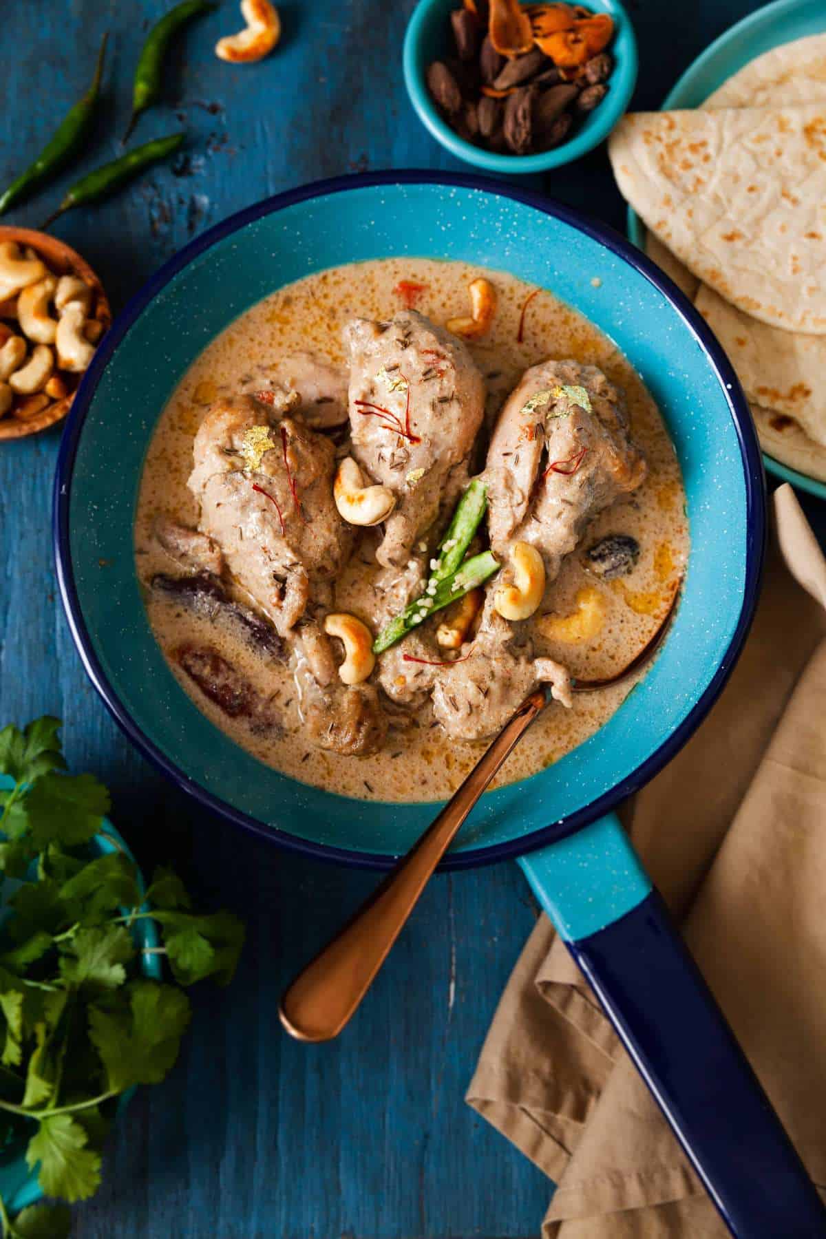 Chicken rezala served with naan. 