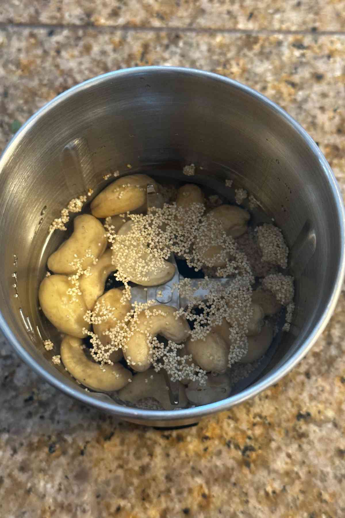 Raw cashew nuts and white poppy seeds soaking in water. 