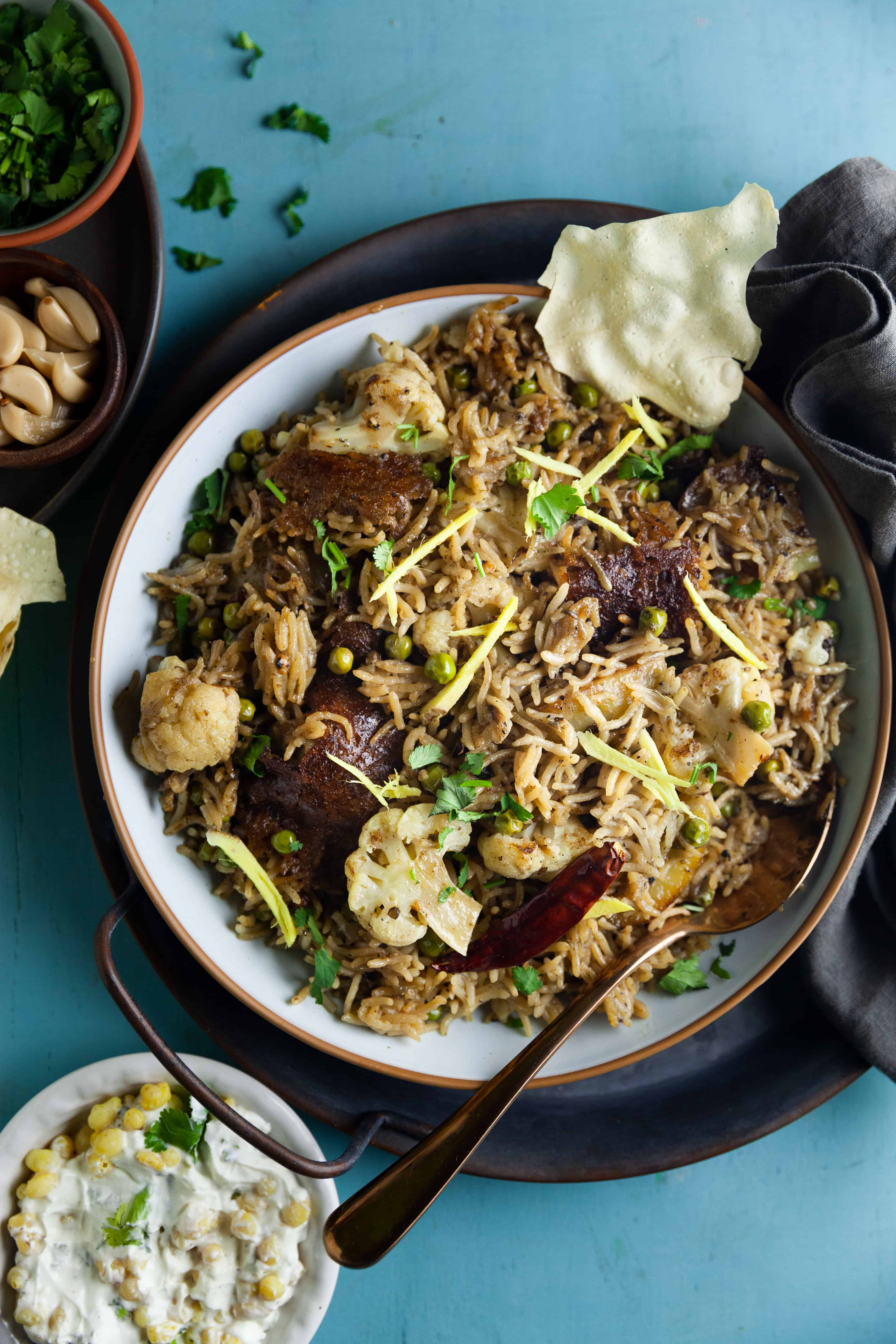 Tahiri served on a light blue bowl with ginge rjulinese and crispy rice crust.