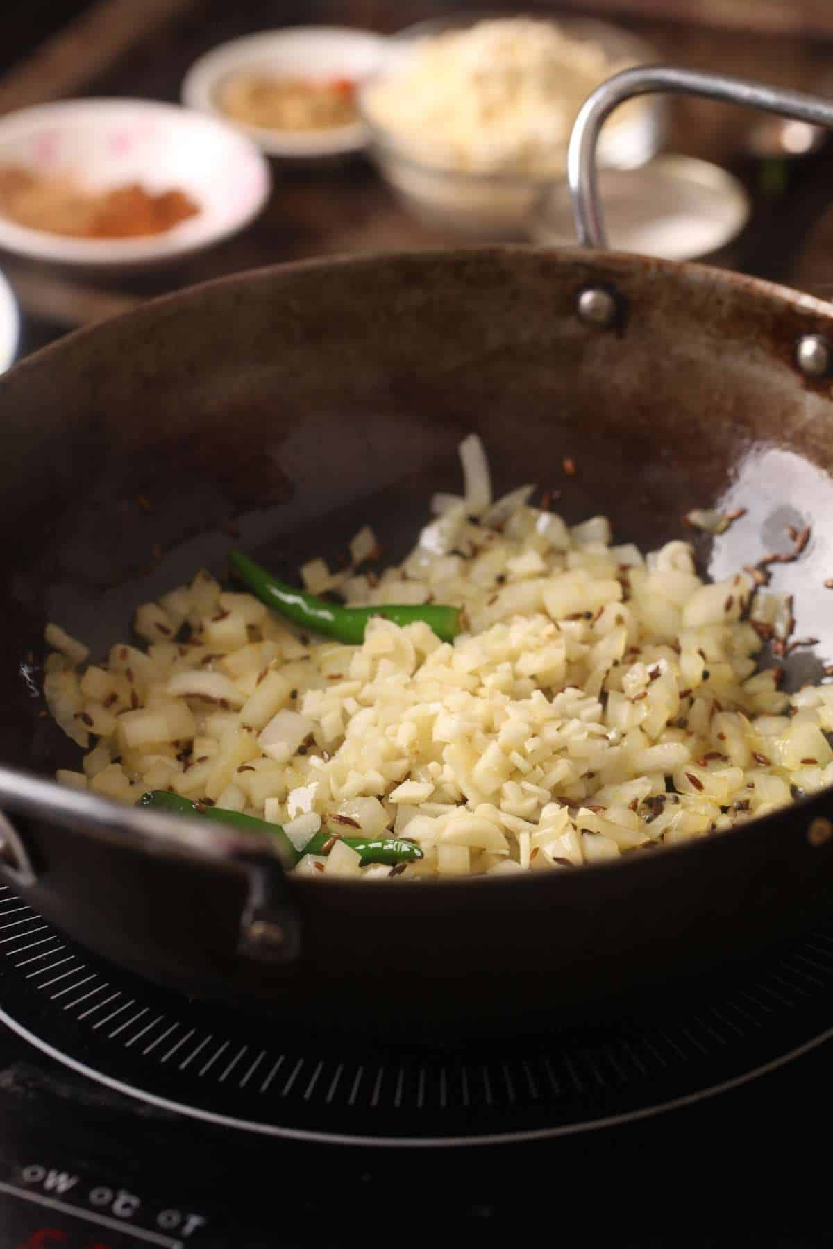 Onion Garlic and whole spices sautéing in oil