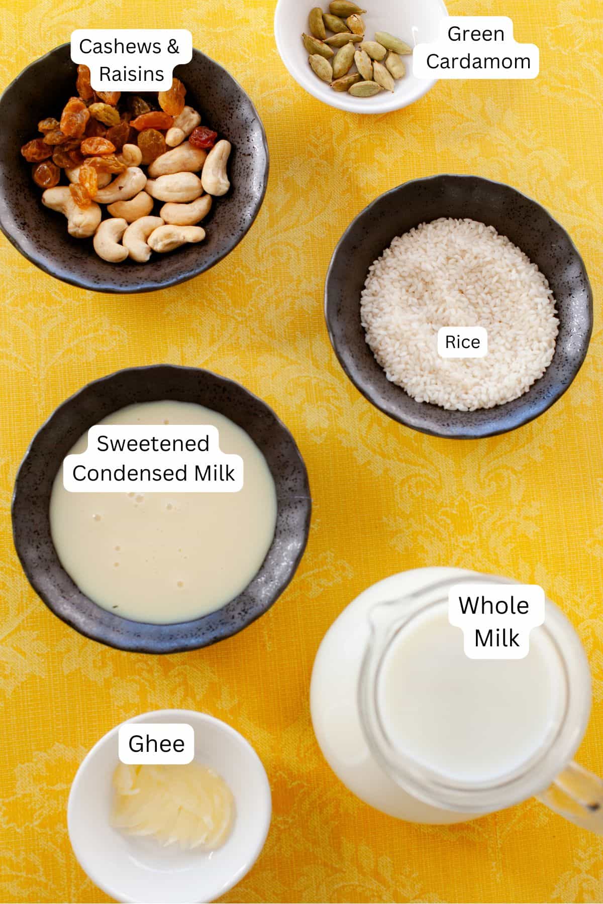 Ingredients for rice kheer on a yellow background.