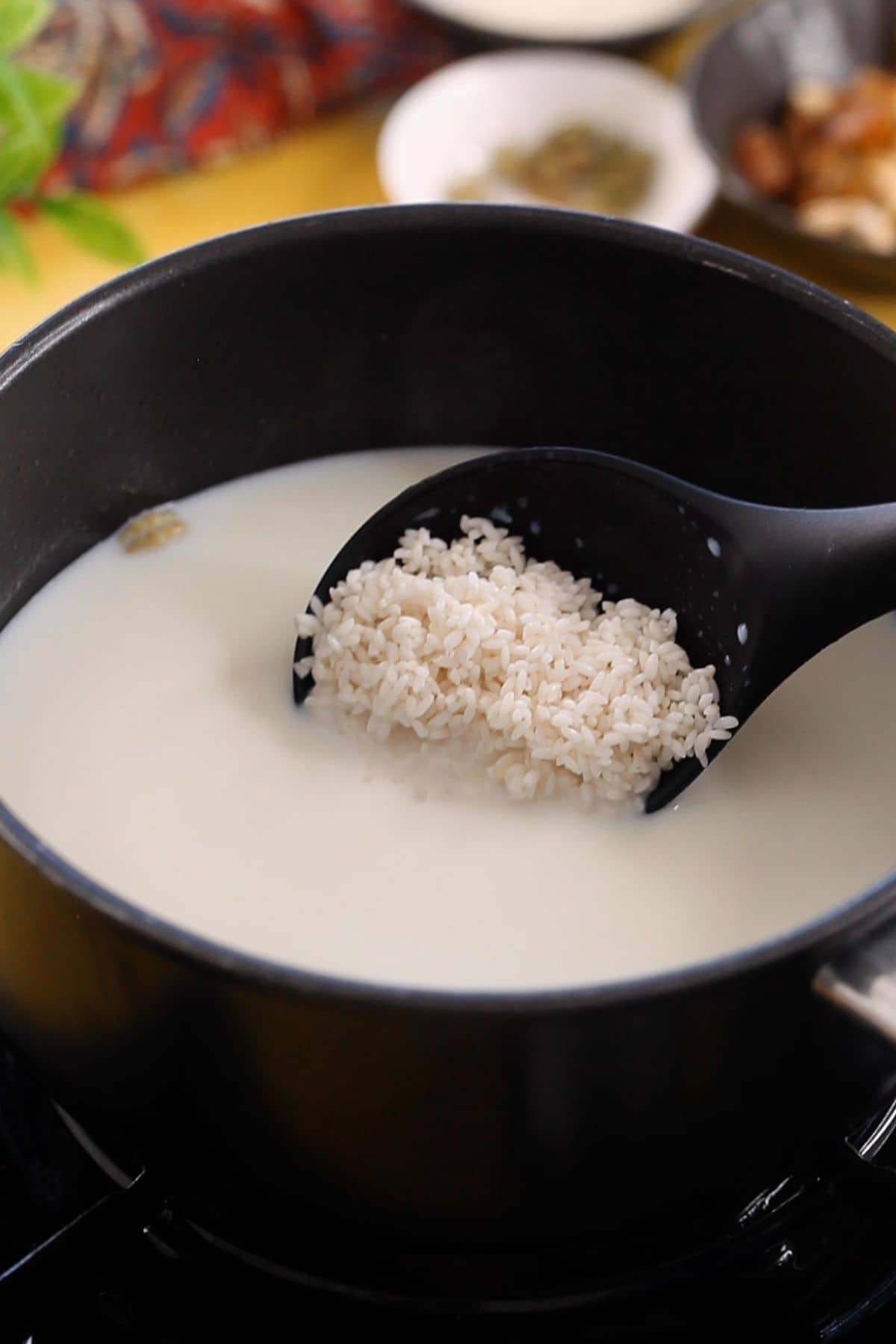 Soaked rice is added to the milk.