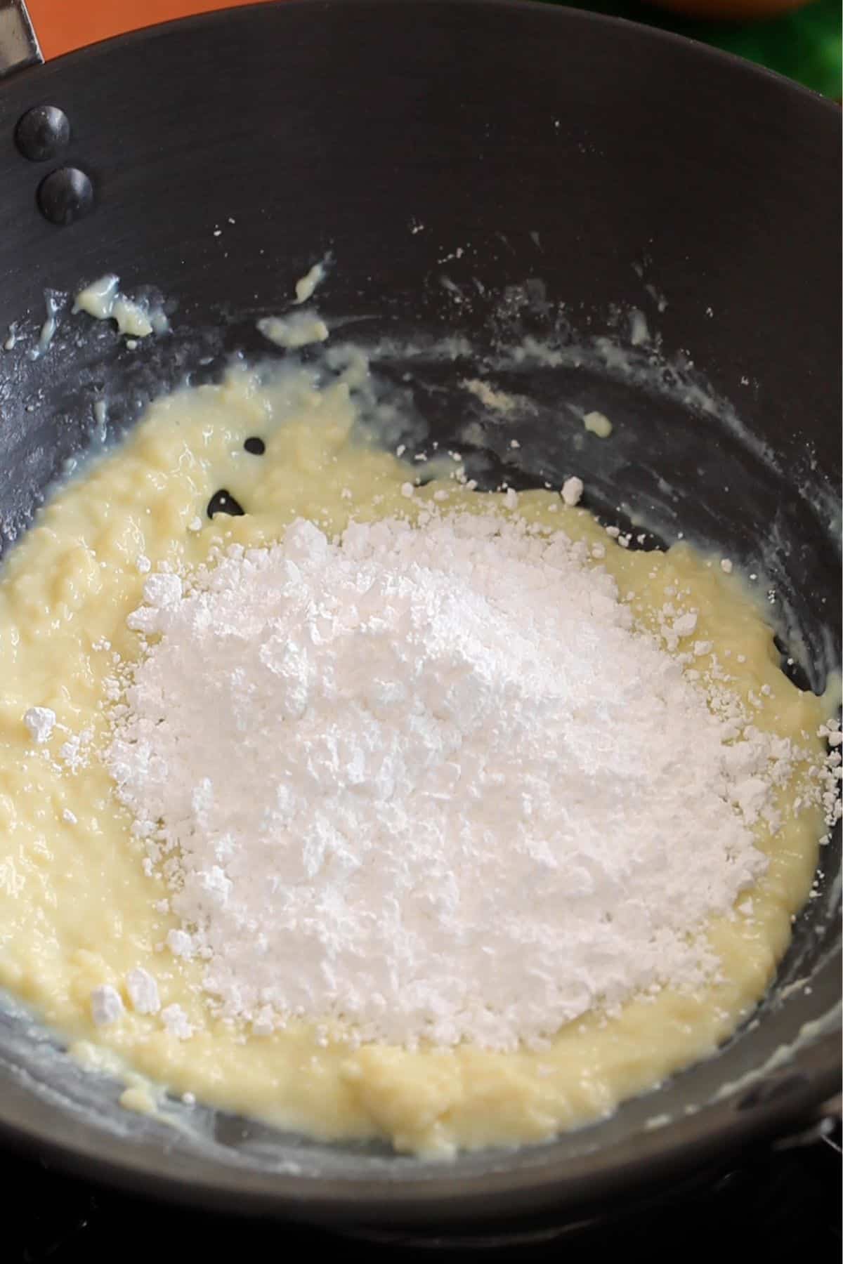 Powdered sugar is added to the peda mixture.