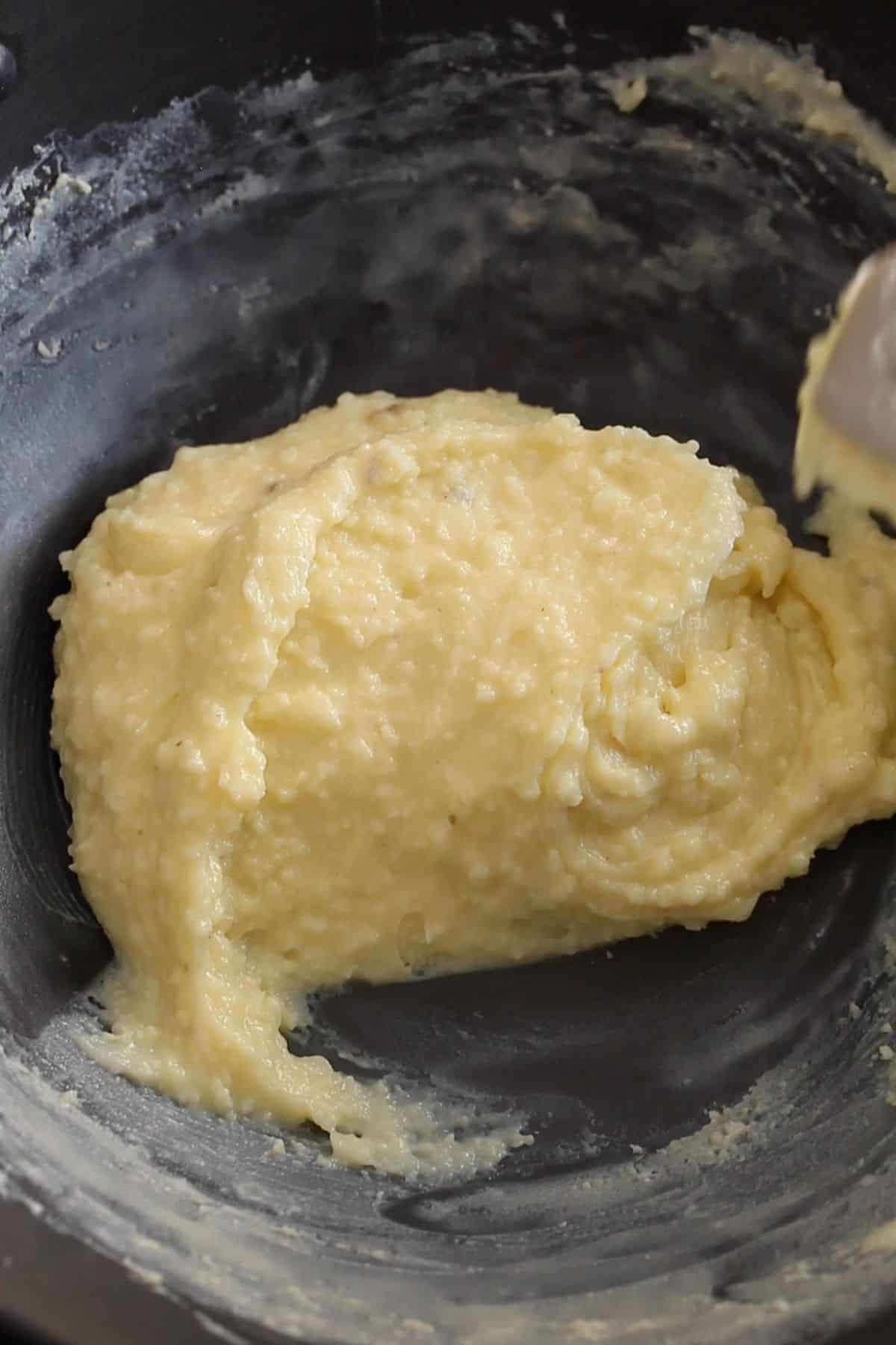 Peda mixture is cooked until it folds over itself.