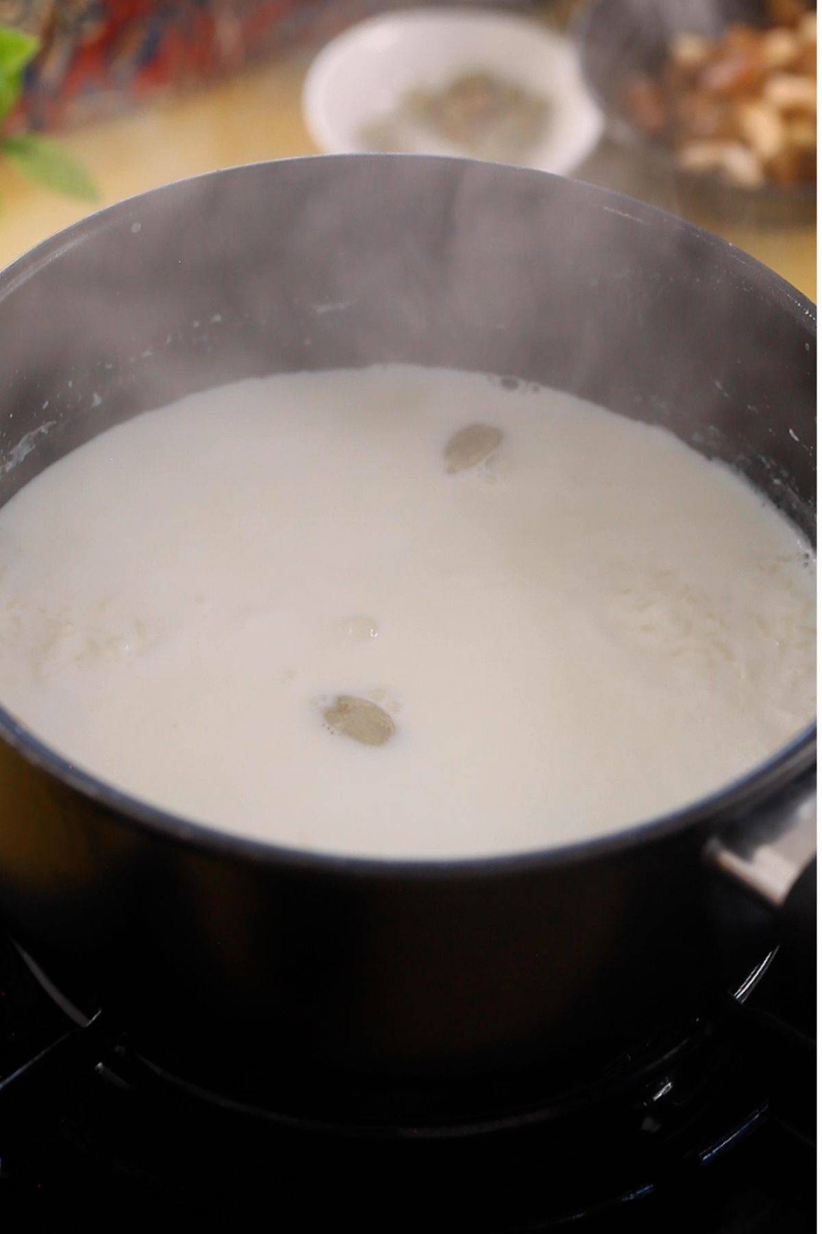 Rice and milk slow cooking on stove top.