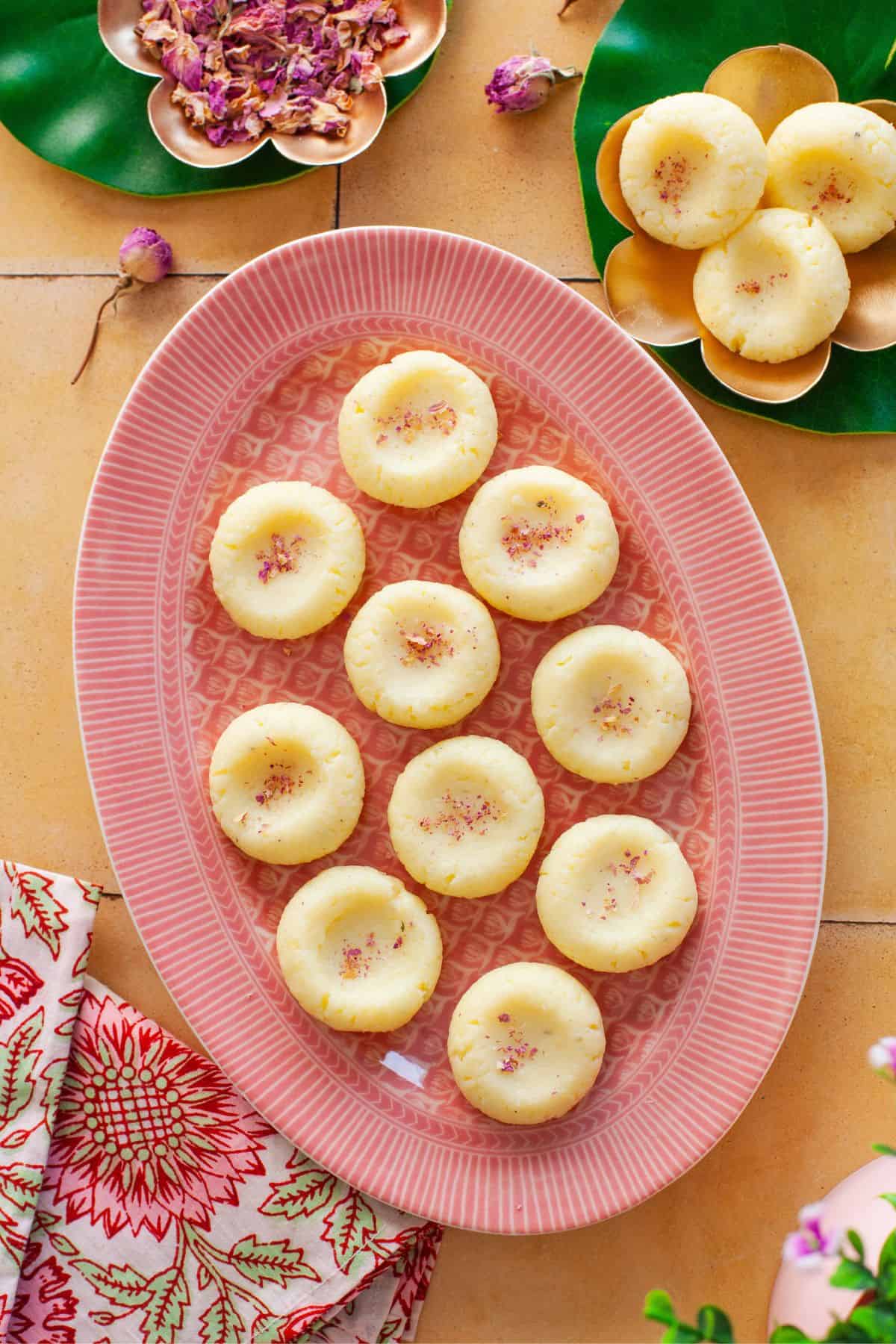 Creamy peda on a oval platter. 