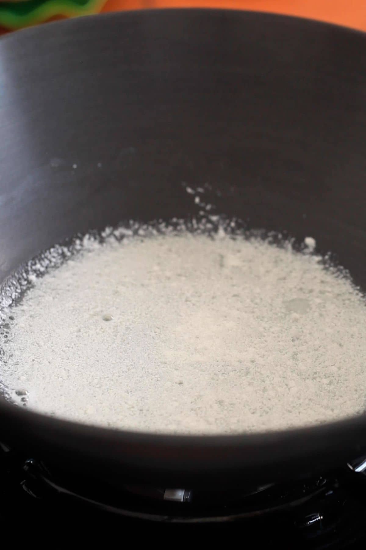 Milk curdles after adding lemon juice.