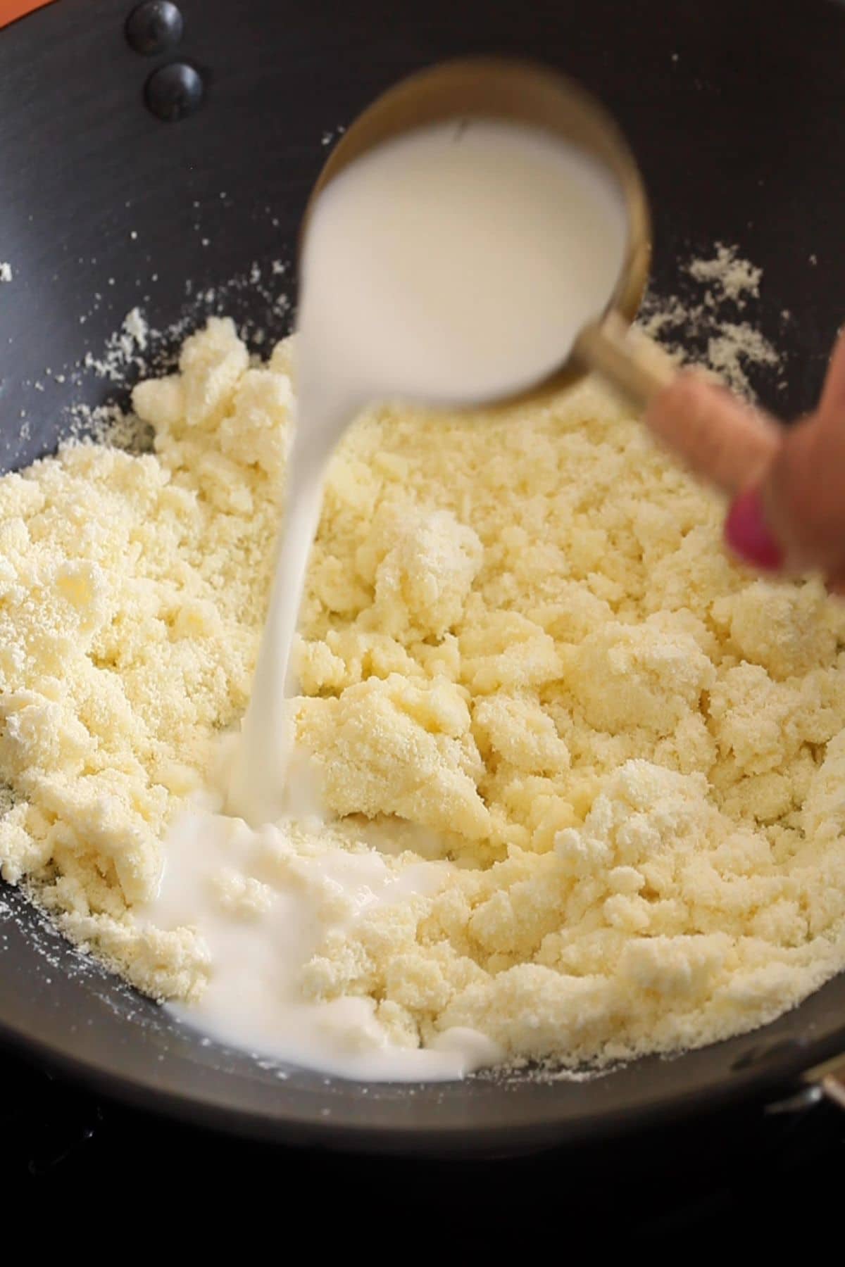 Ghee and milk are added to the milk powder.