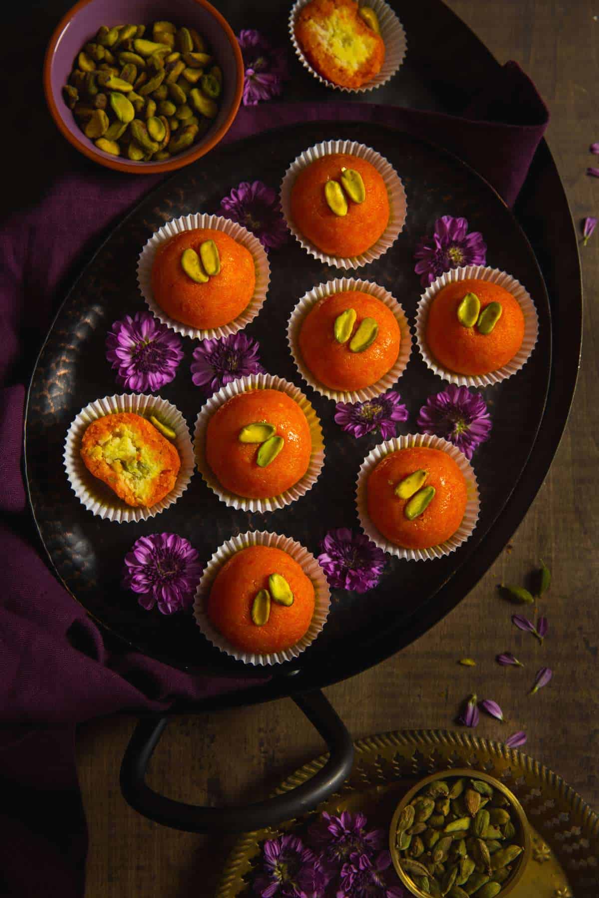 Gajar ladoo on a platter with few showing the mawa filling.