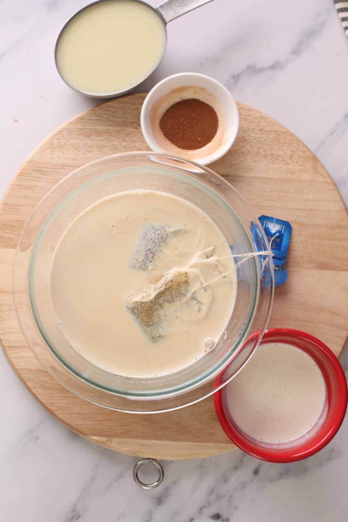 Making black tea infused evaporated milk mixture. 