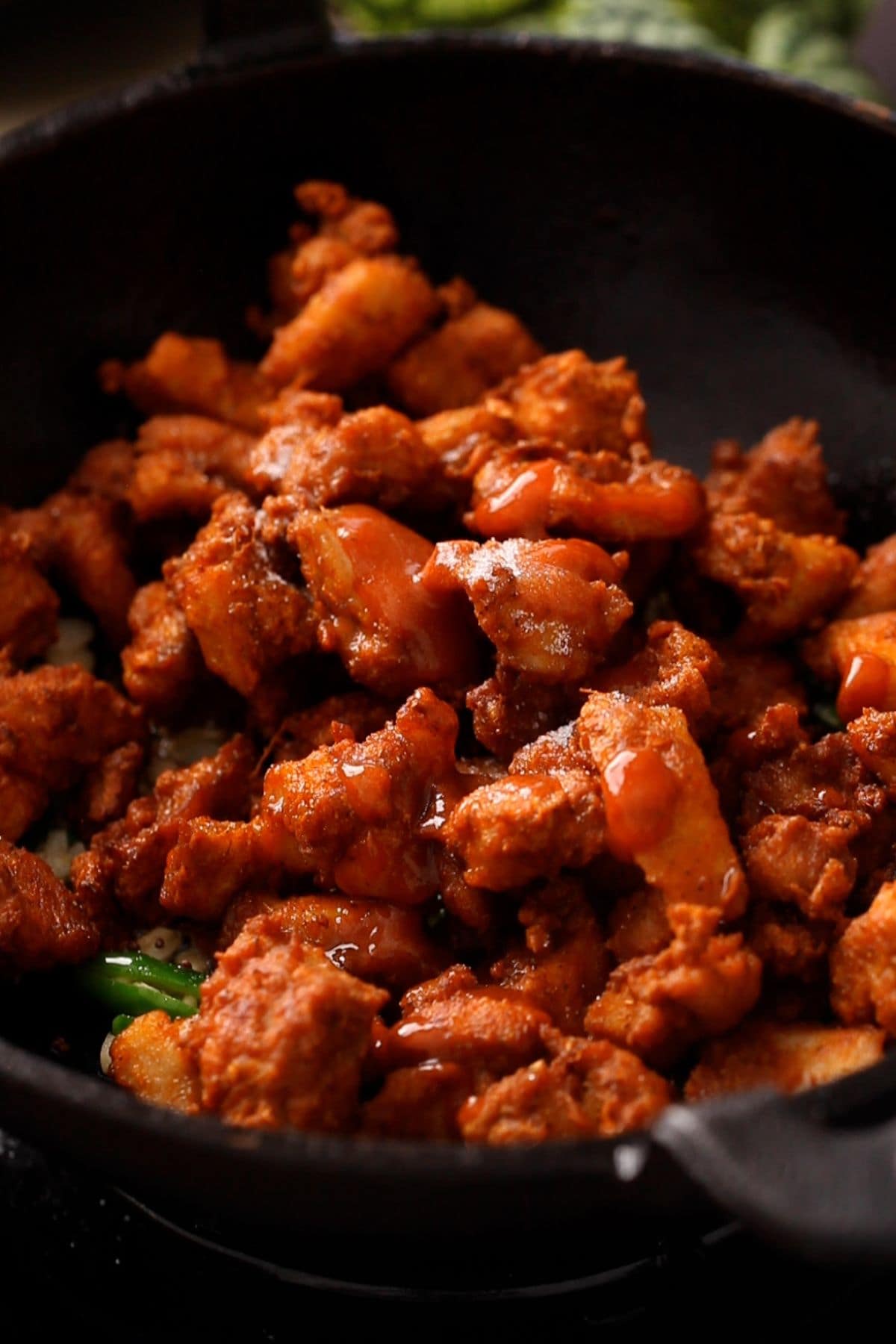 Crispy fried chicken is added to the tempering.
