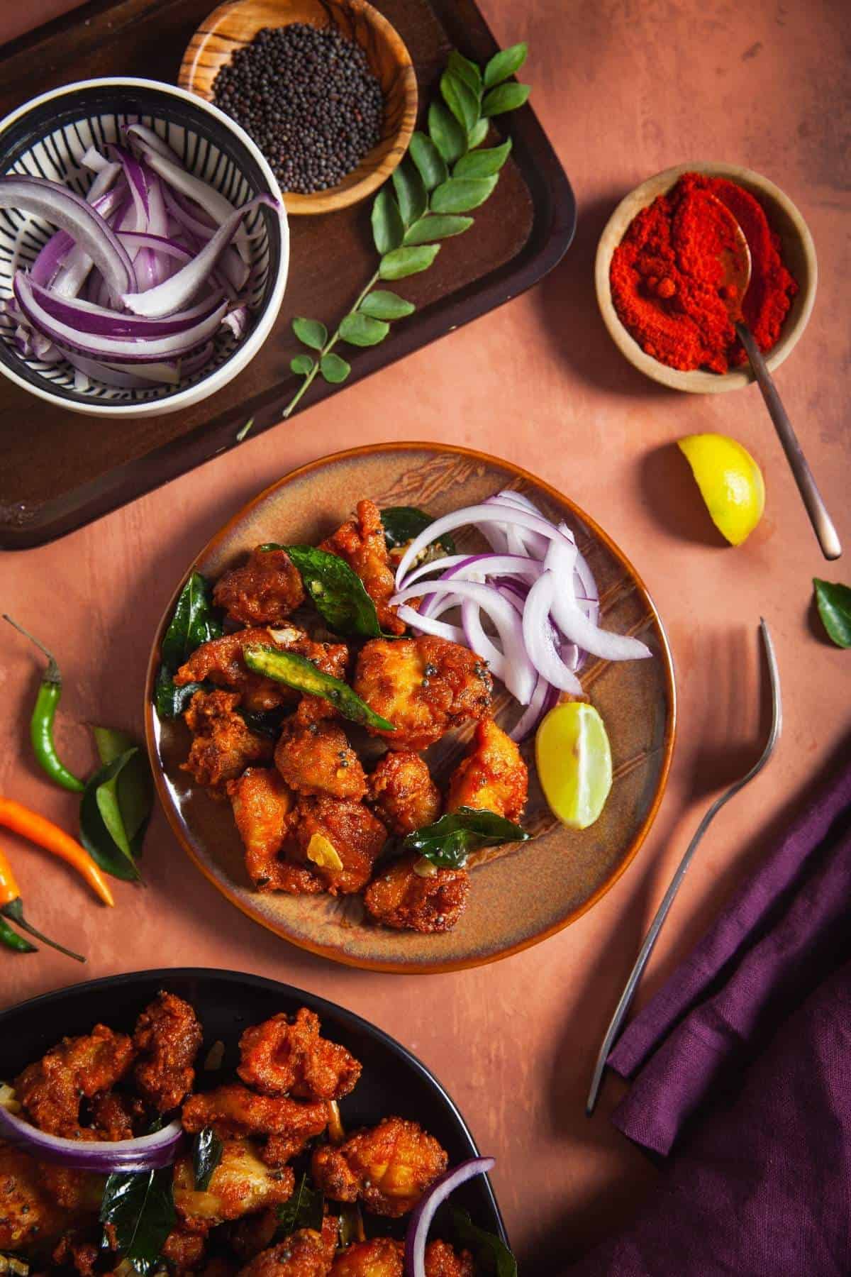 Chicken 65 served with sliced onions 